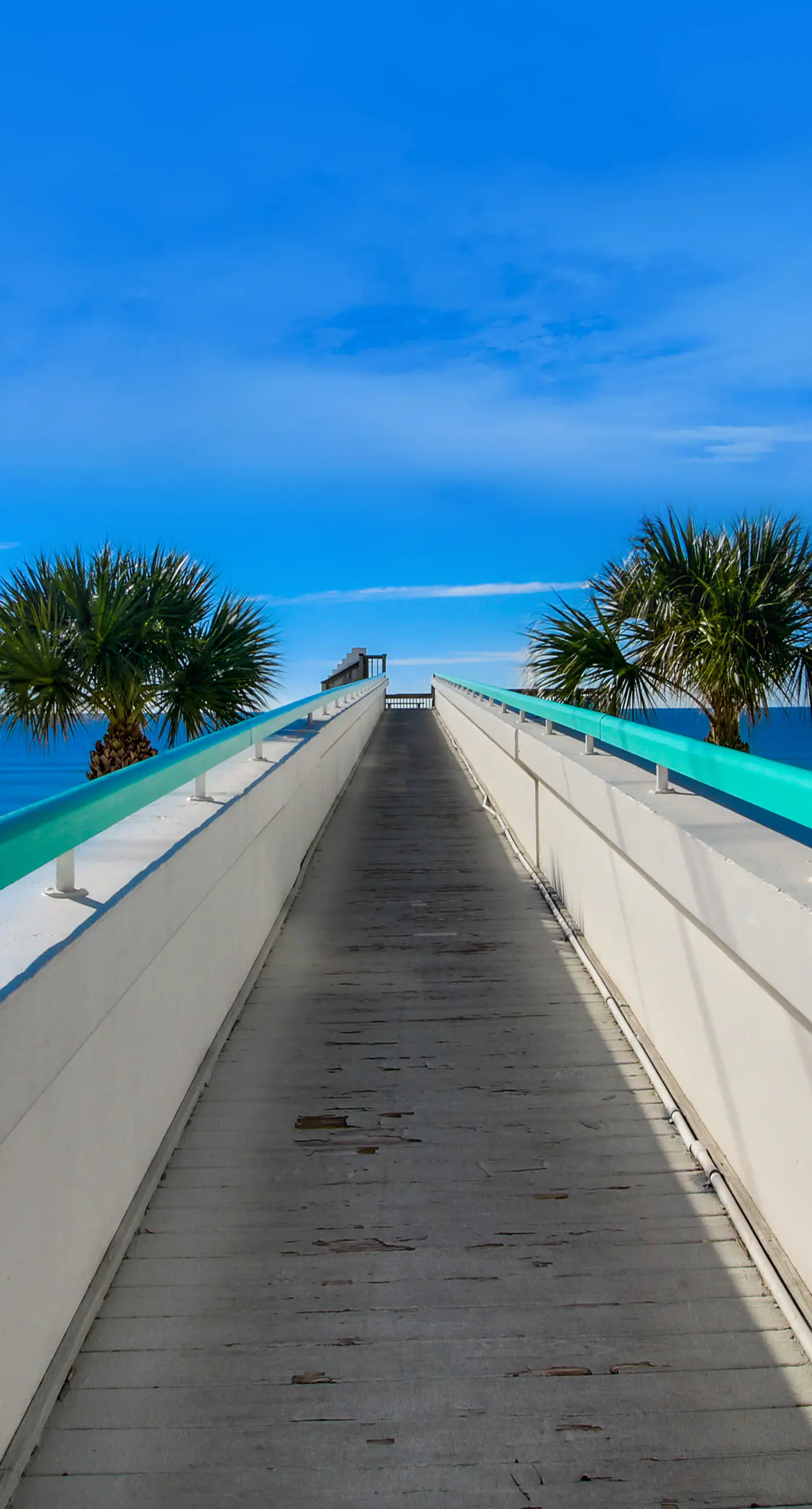 Cozy coastal condo with balcony, beach views, & resort pool