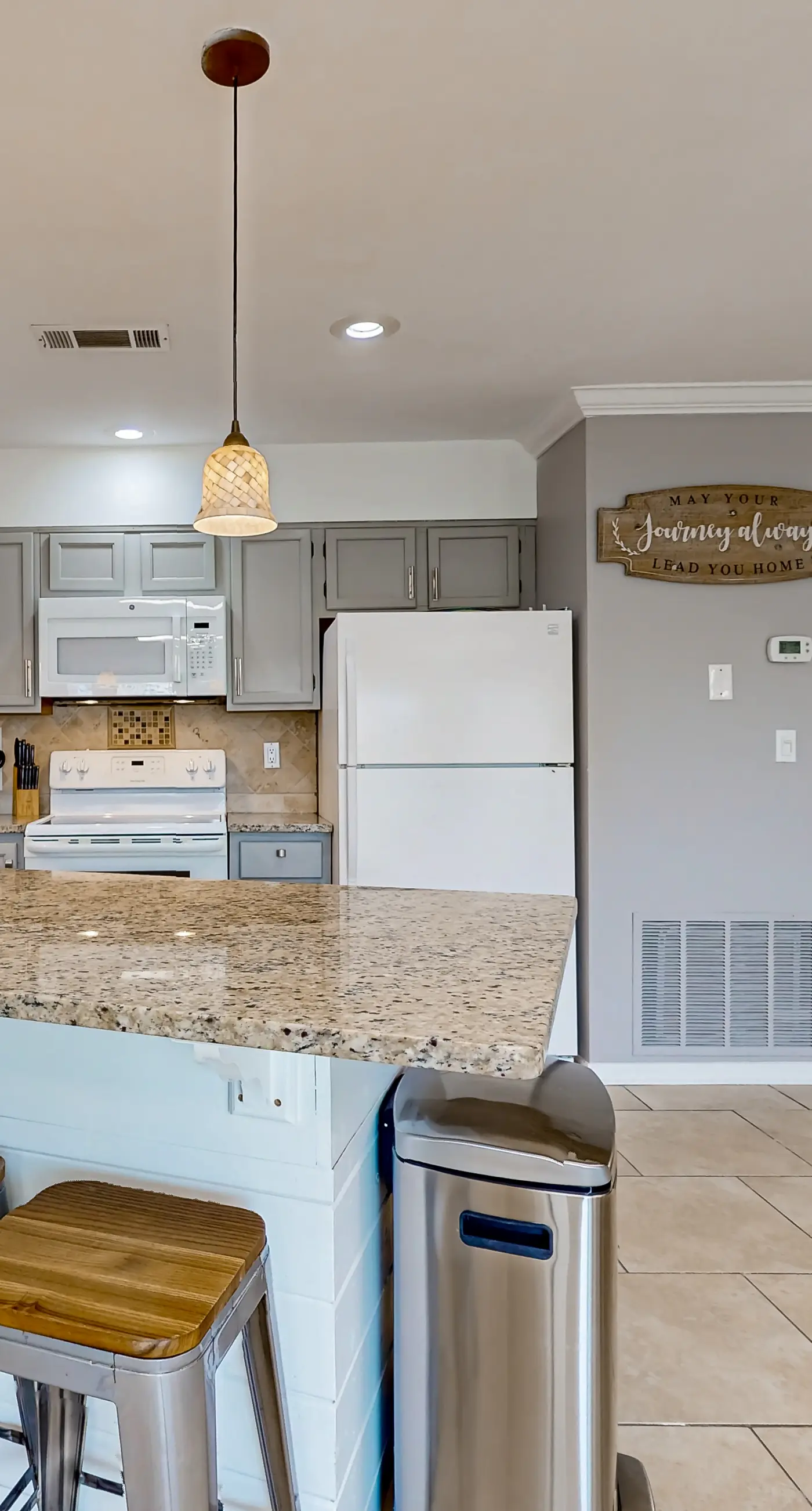 Ground-floor beach condo w/ a full kitchen, shared saltwater pool, & playground