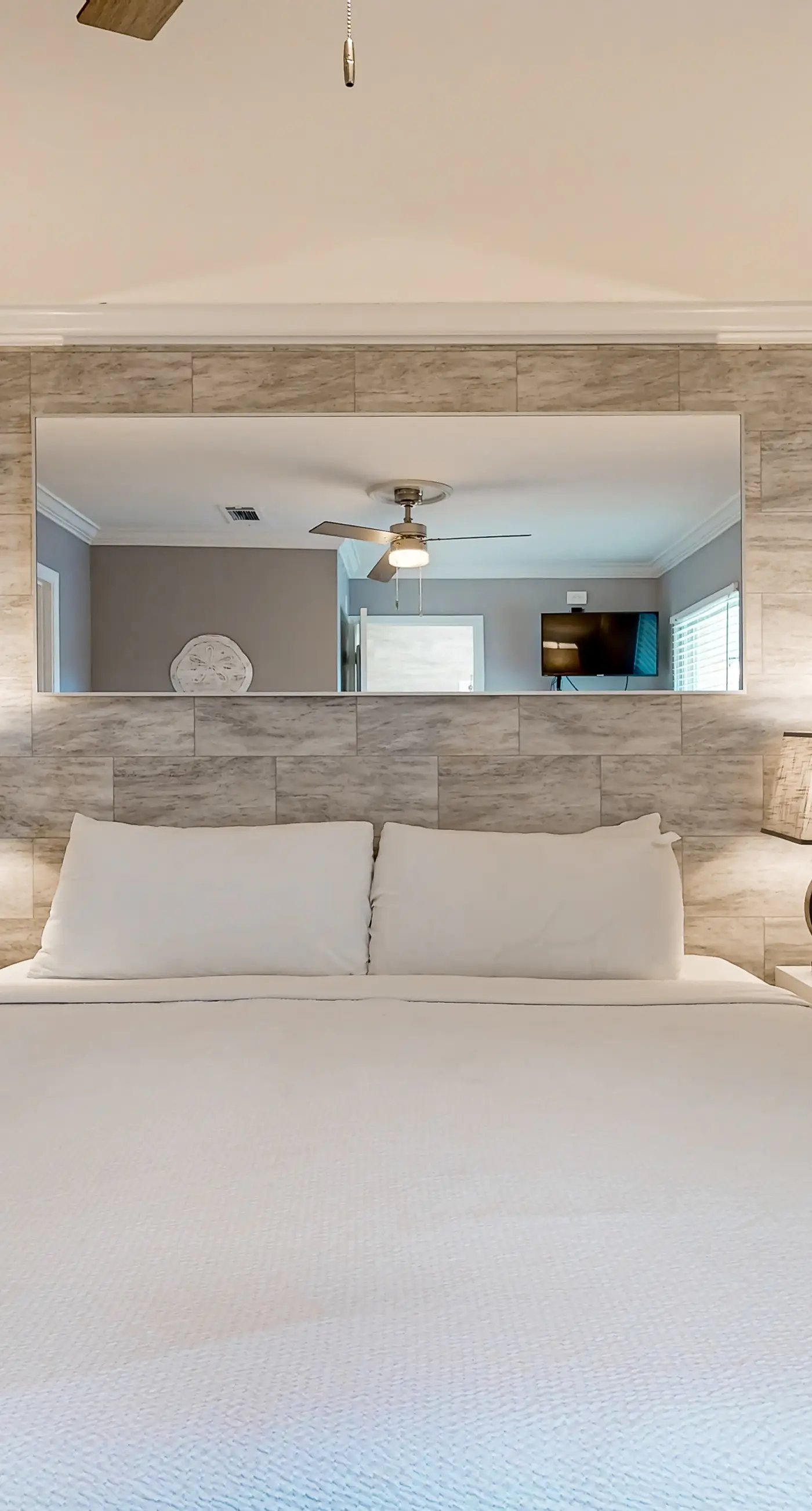 Ground-floor beach condo w/ a full kitchen, shared saltwater pool, & playground