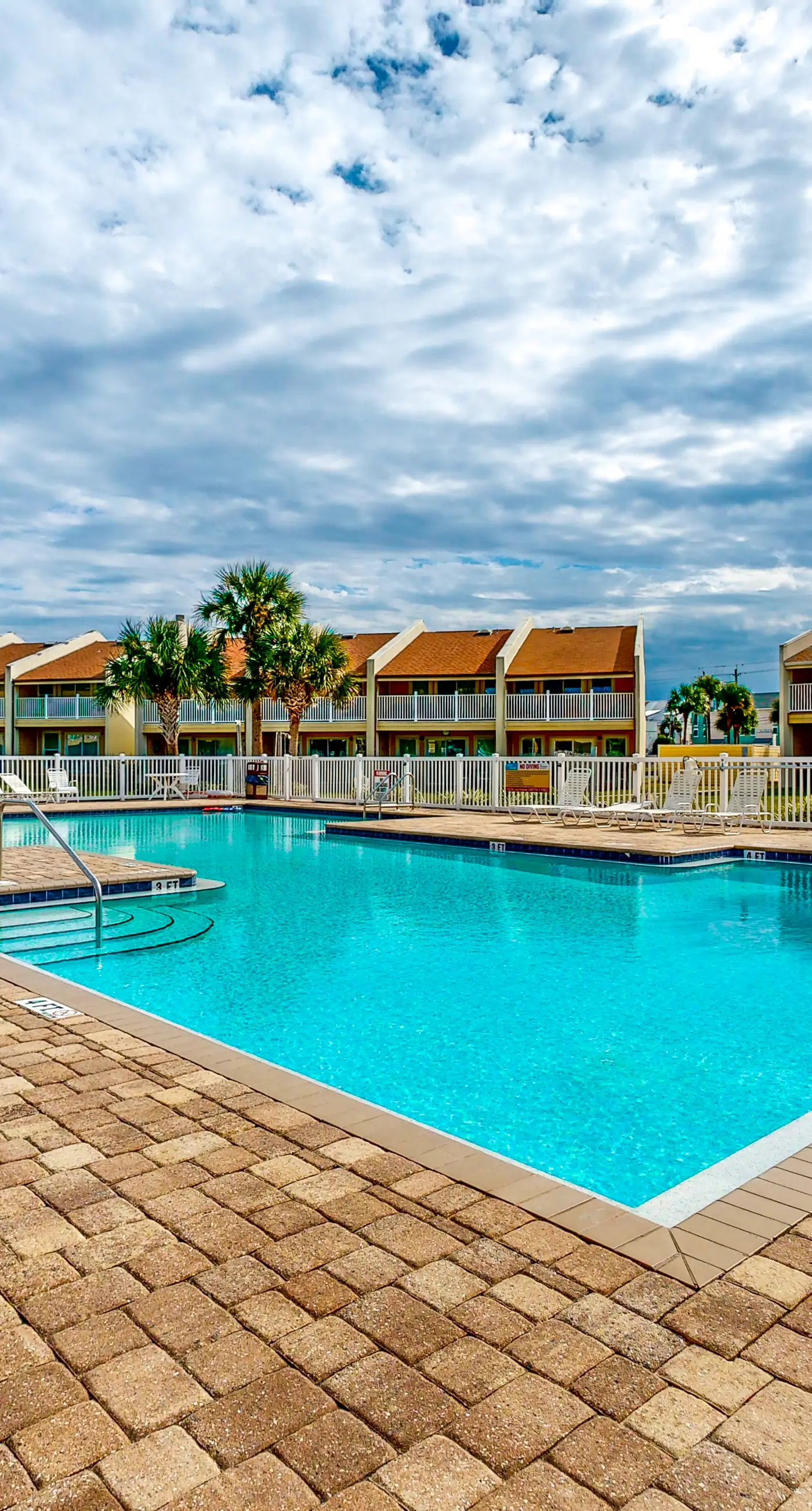 Ground-floor beach condo w/ a full kitchen, shared saltwater pool, & playground