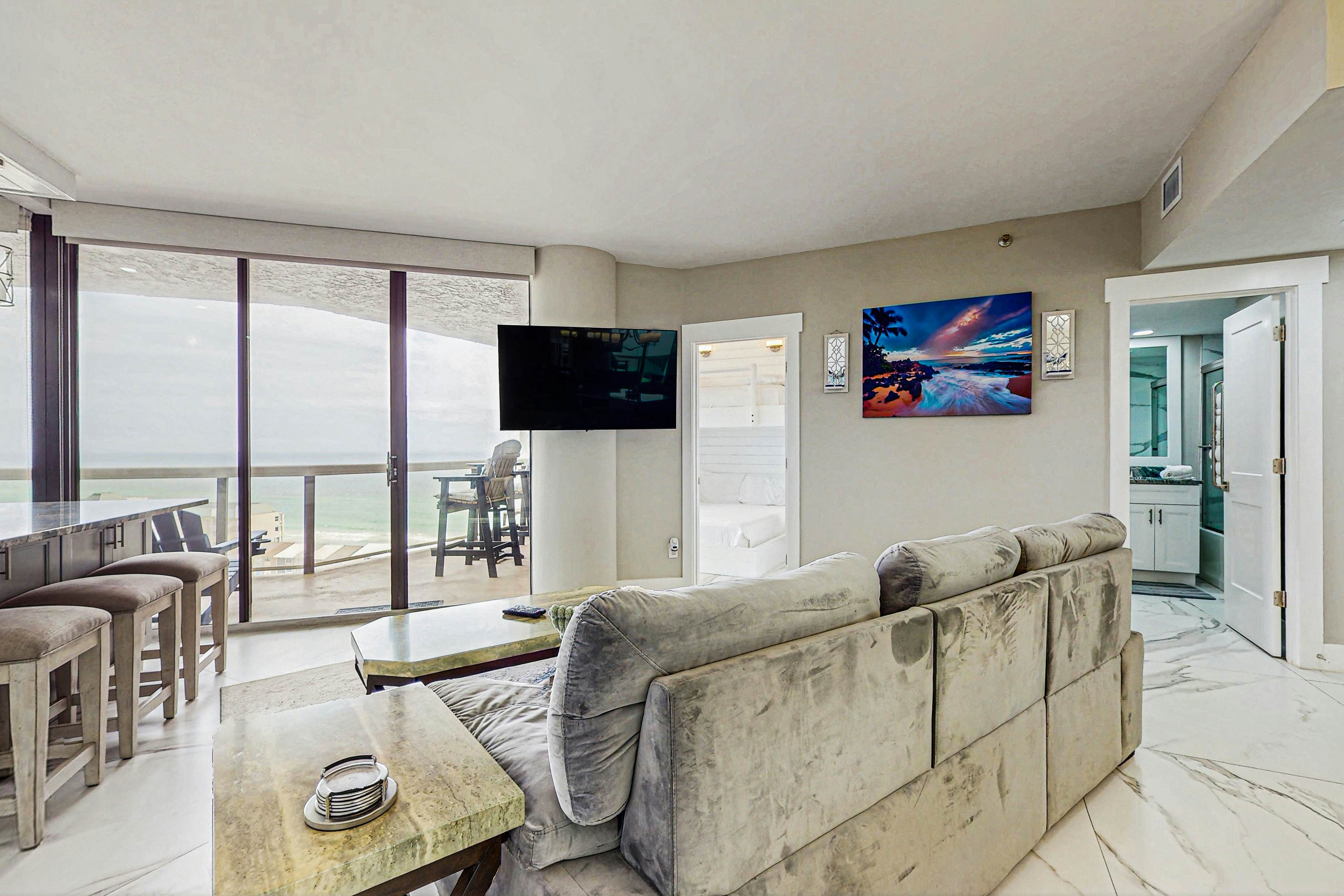 Waterfront condo with scenic views, huge balcony, pool, hot tub, & gym access