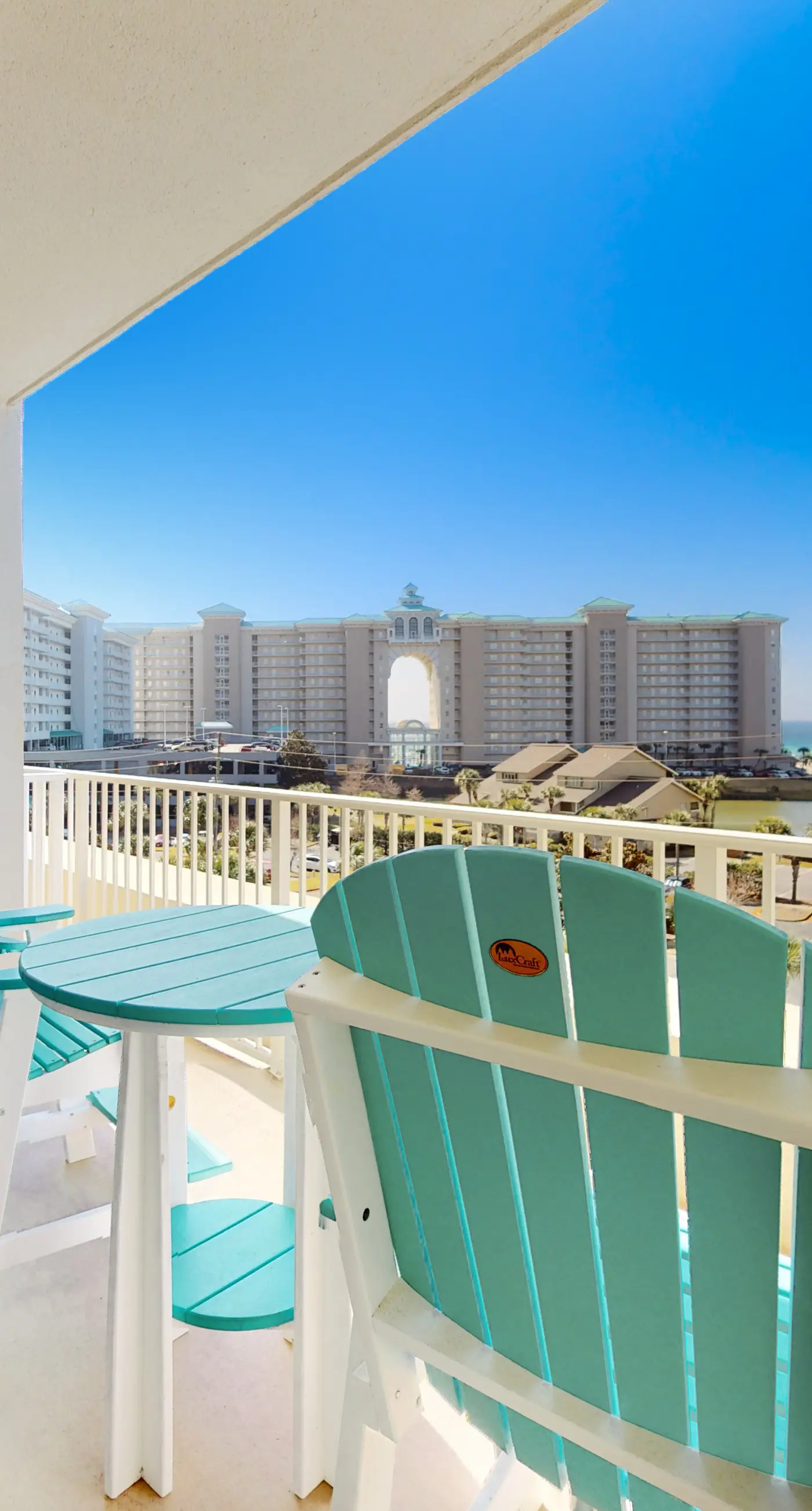 Fifth-floor condo with furnished balcony, beach access & views, shared pool & gym