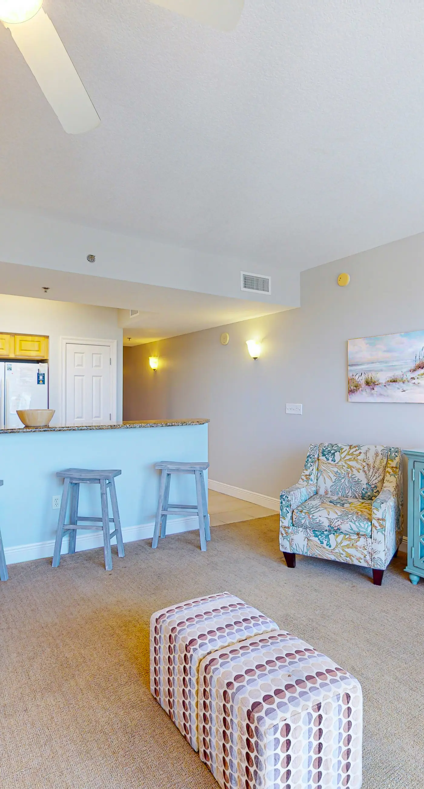 Fifth-floor condo with furnished balcony, beach access & views, shared pool & gym