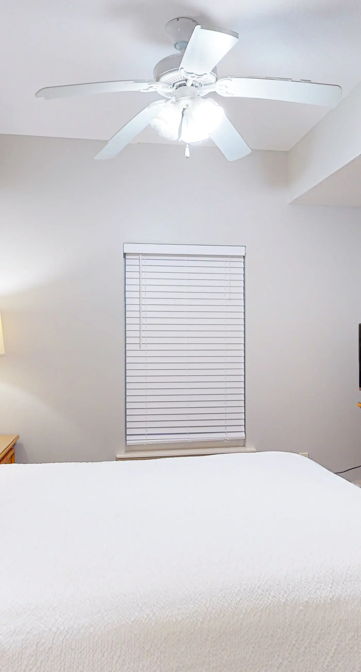 Fifth-floor condo with furnished balcony, beach access & views, shared pool & gym