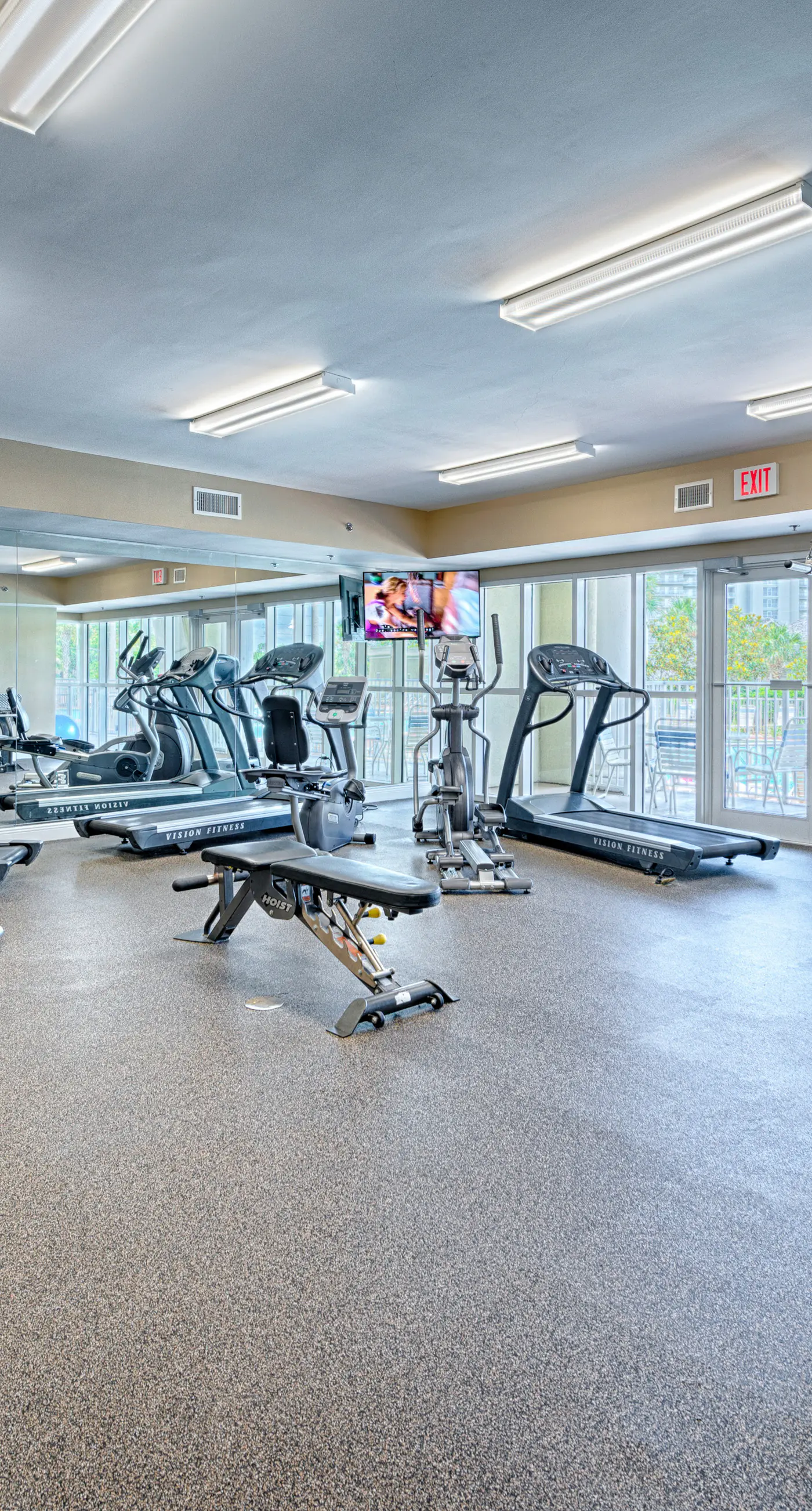 Fifth-floor condo with furnished balcony, beach access & views, shared pool & gym