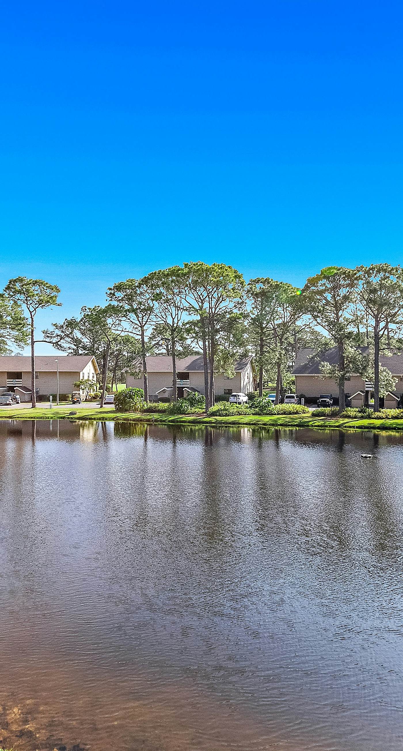 Lakefront condo with on-site golf, pool access, tennis, gym, & balcony