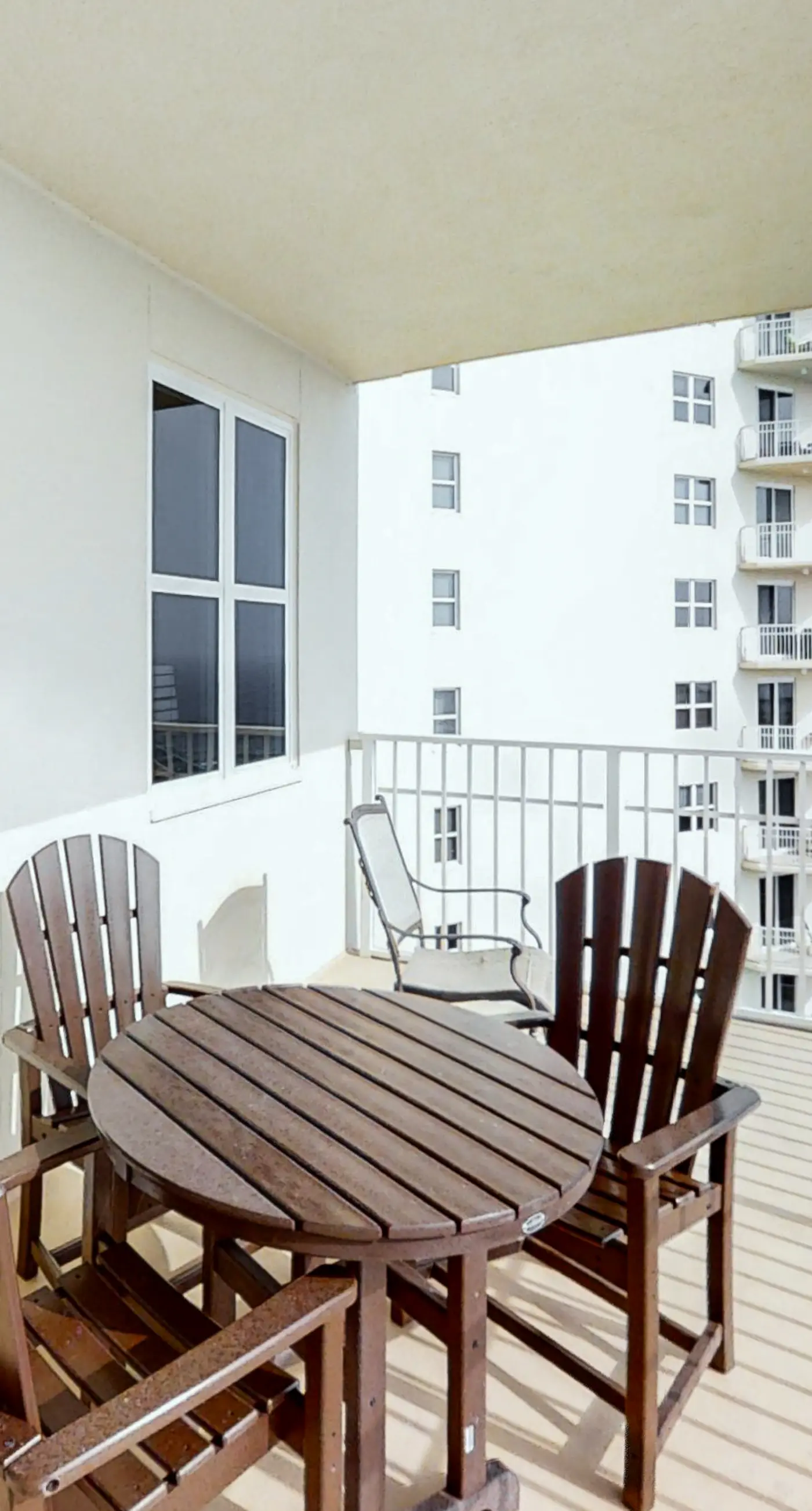 Spacious 18th-floor condo with furnished balcony, shared heated pool, gym, & more