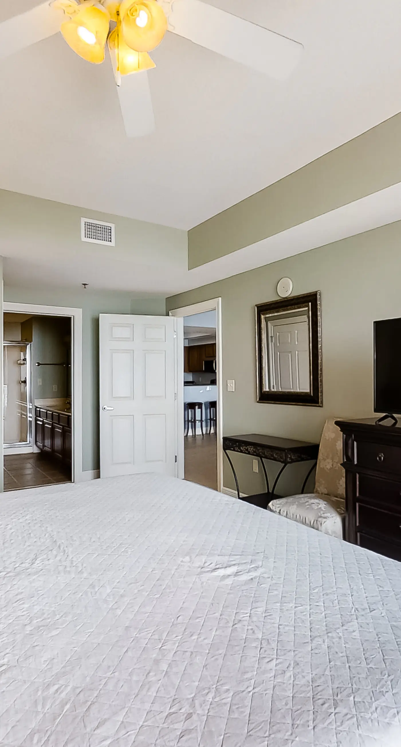 Spacious 18th-floor condo with furnished balcony, shared heated pool, gym, & more