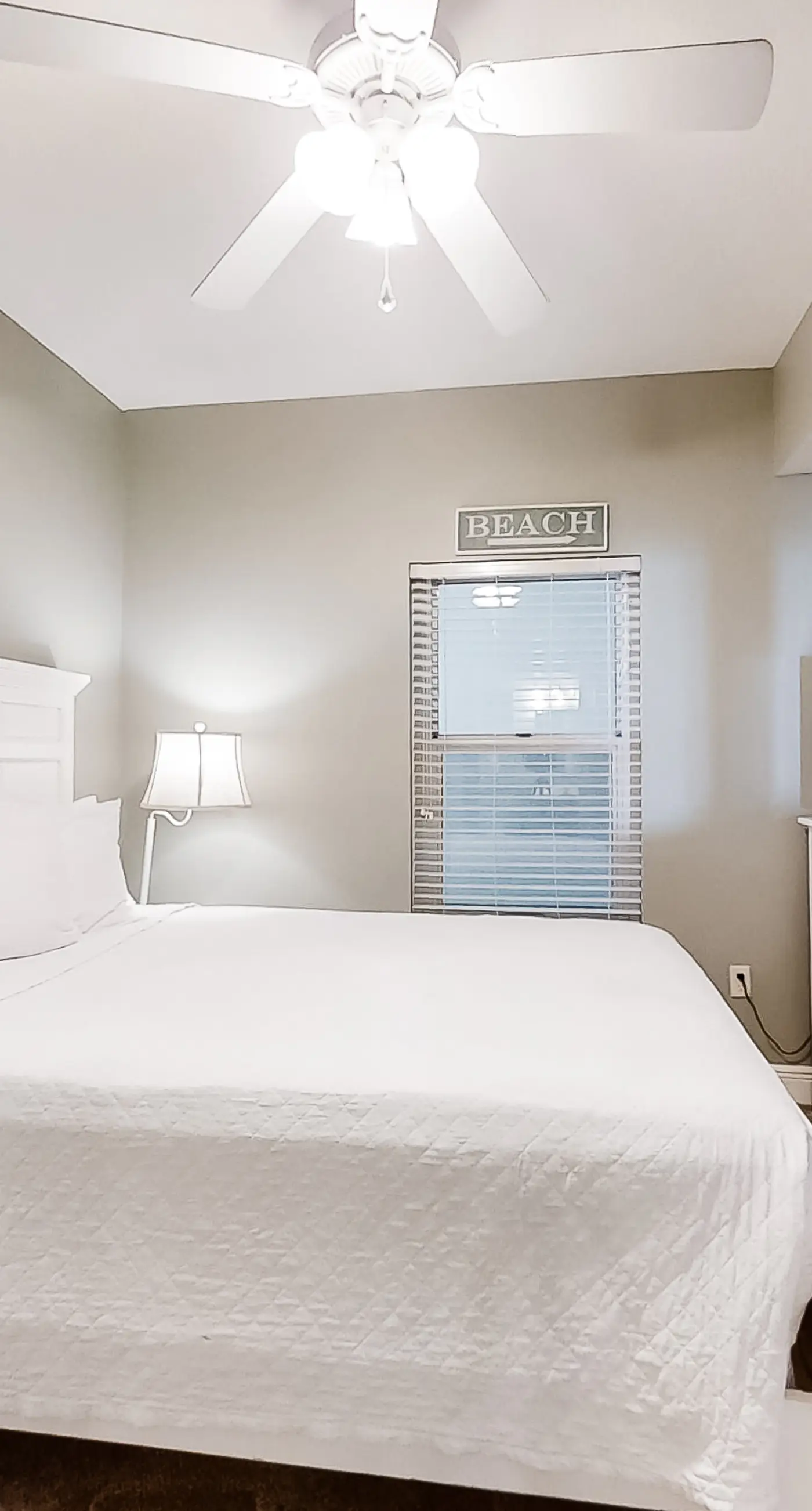 Spacious 18th-floor condo with furnished balcony, shared heated pool, gym, & more
