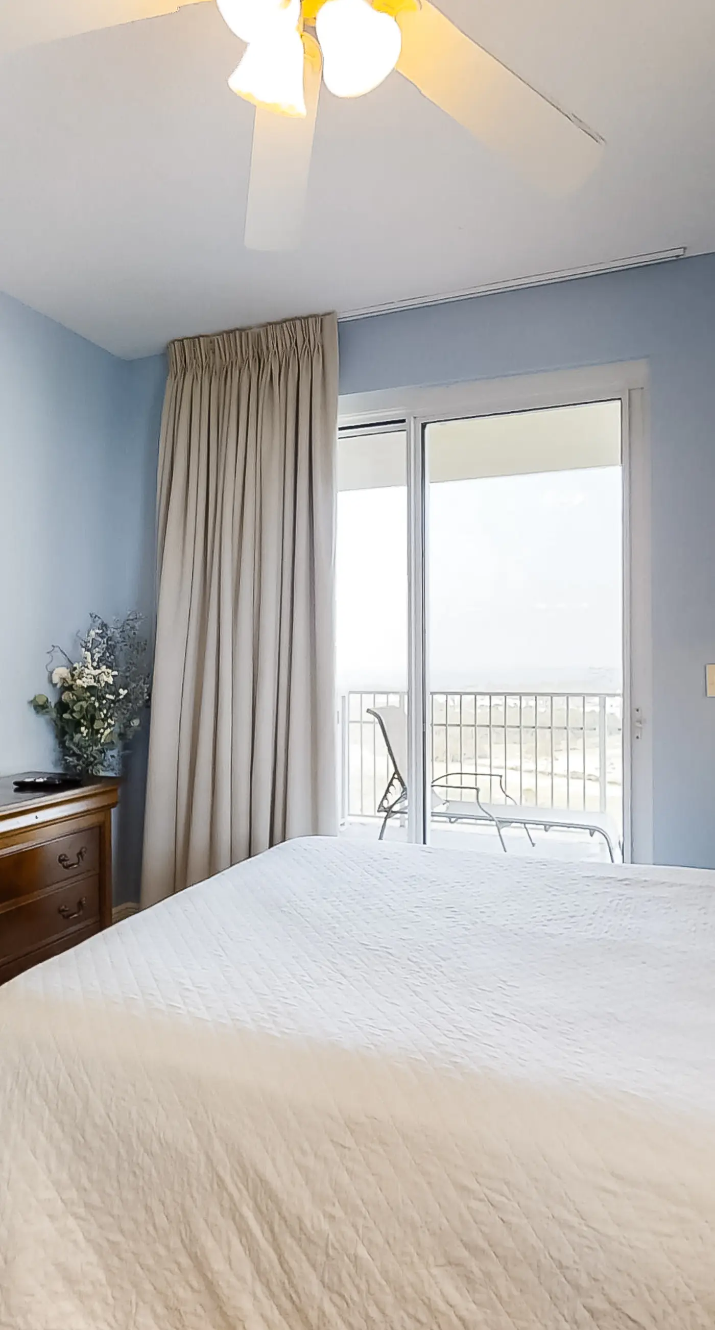 Spacious 18th-floor condo with furnished balcony, shared heated pool, gym, & more