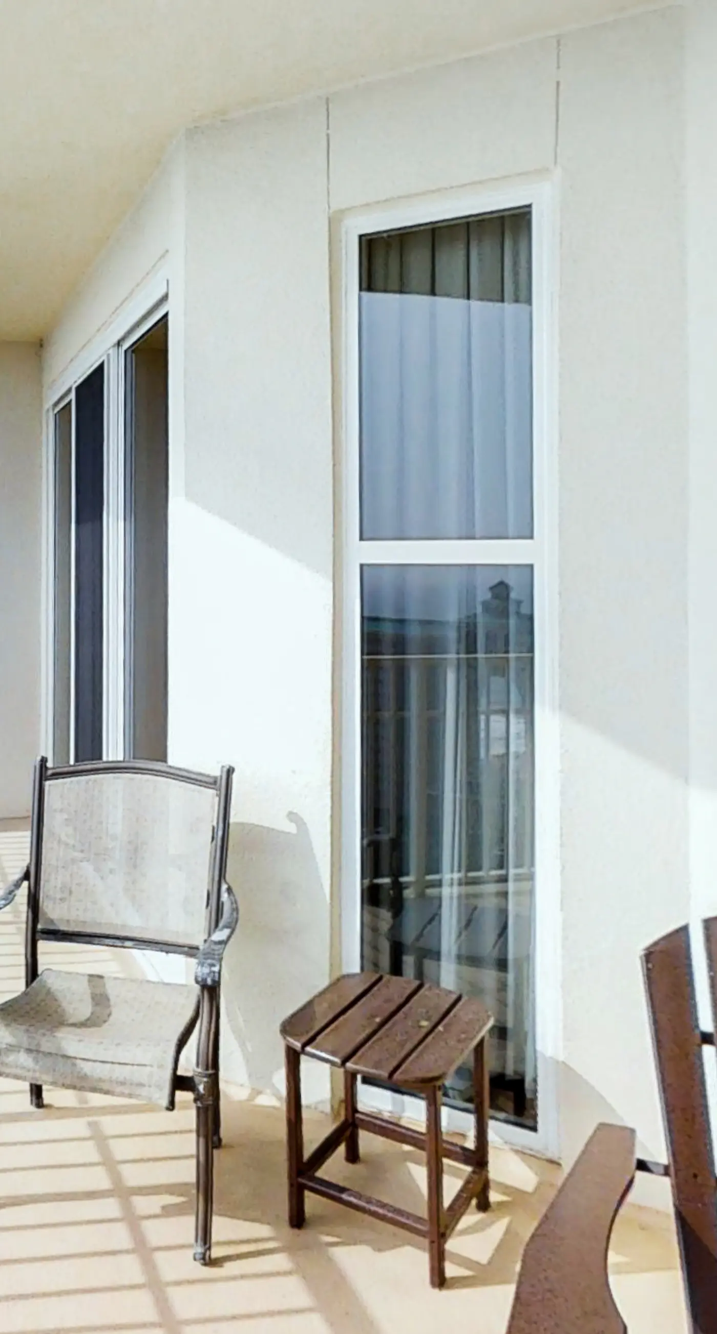 Spacious 18th-floor condo with furnished balcony, shared heated pool, gym, & more