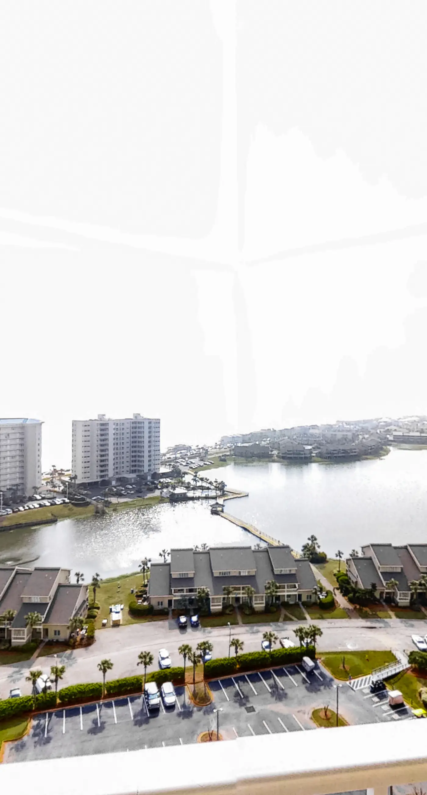 Spacious 18th-floor condo with furnished balcony, shared heated pool, gym, & more