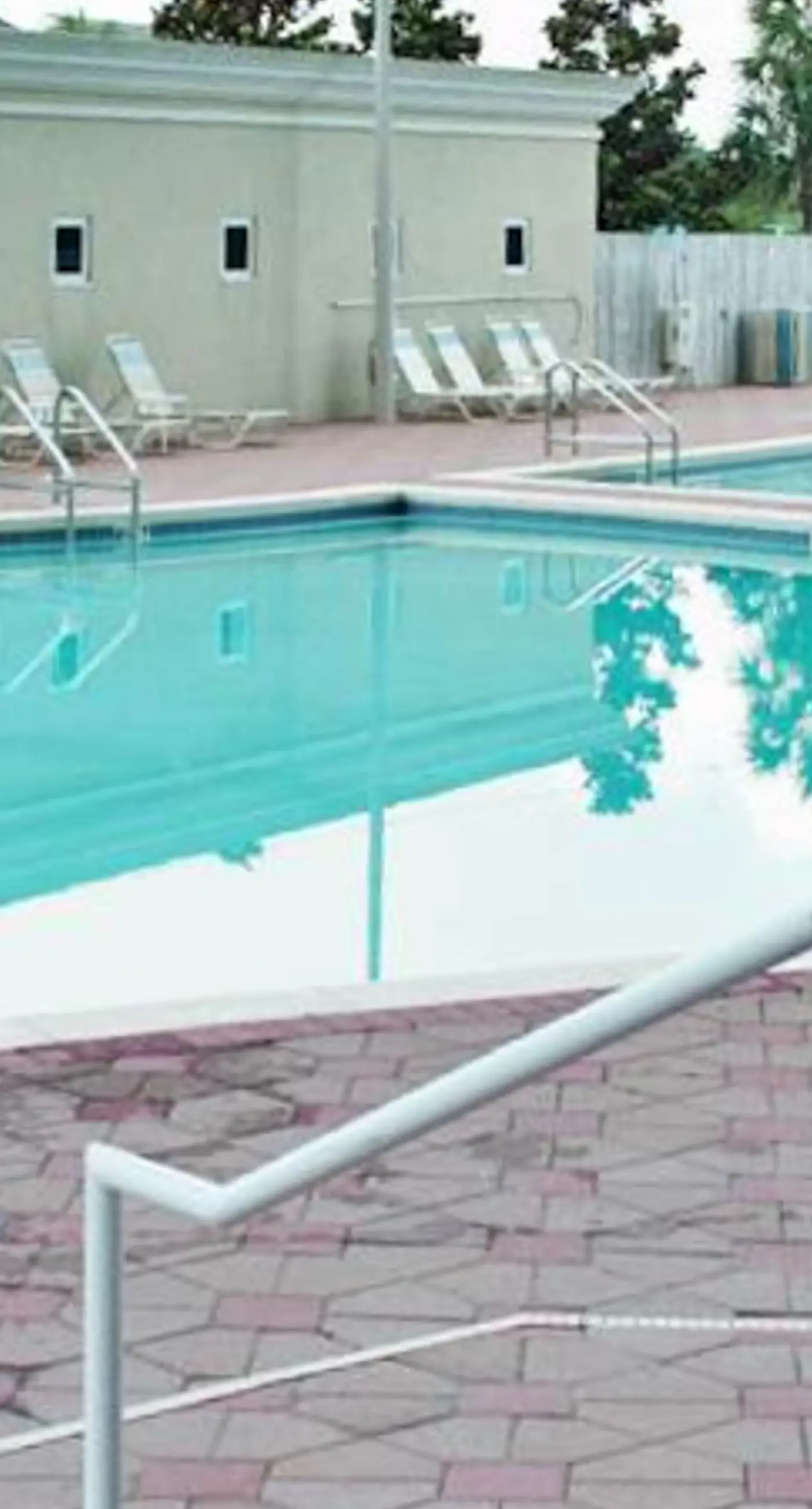 Spacious 18th-floor condo with furnished balcony, shared heated pool, gym, & more