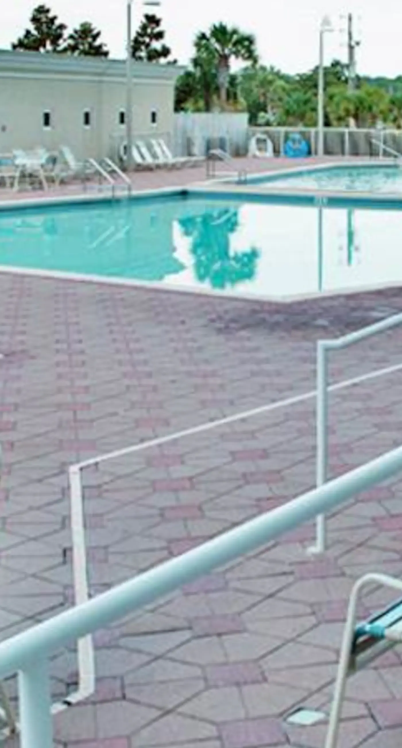 Spacious 18th-floor condo with furnished balcony, shared heated pool, gym, & more