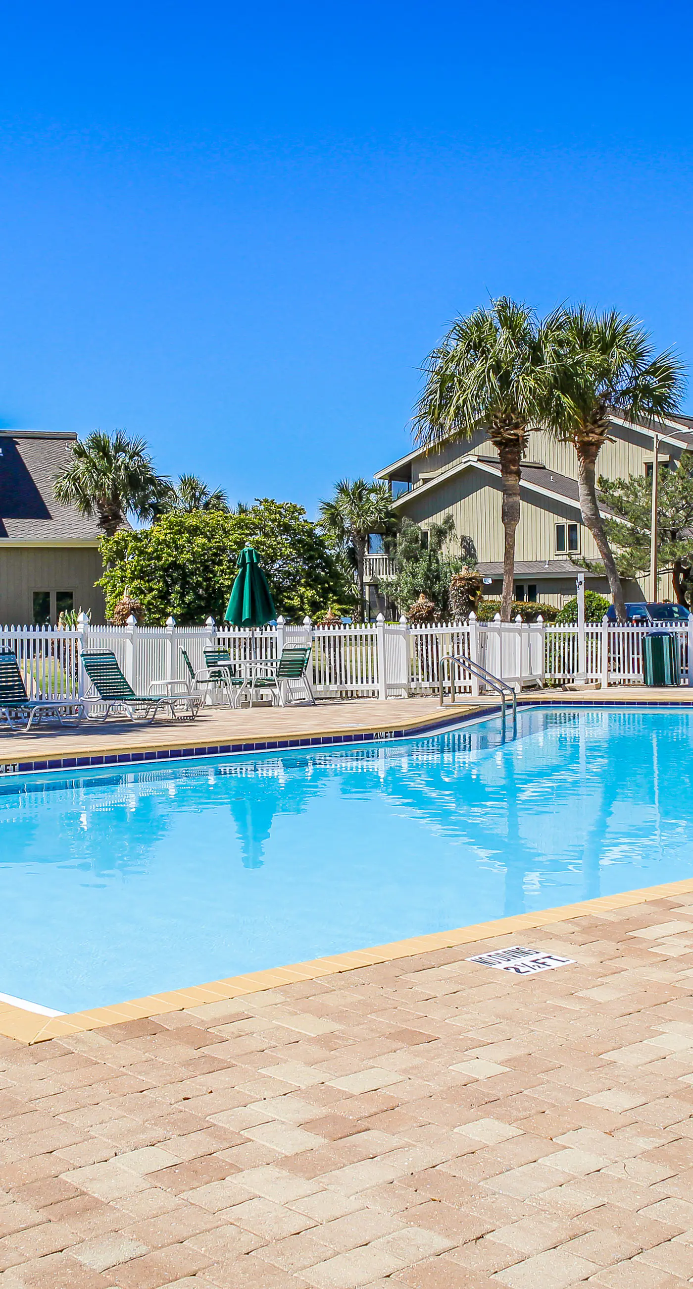 Lakefront condo near the beach with shared pool & two balconies - snowbird friendly