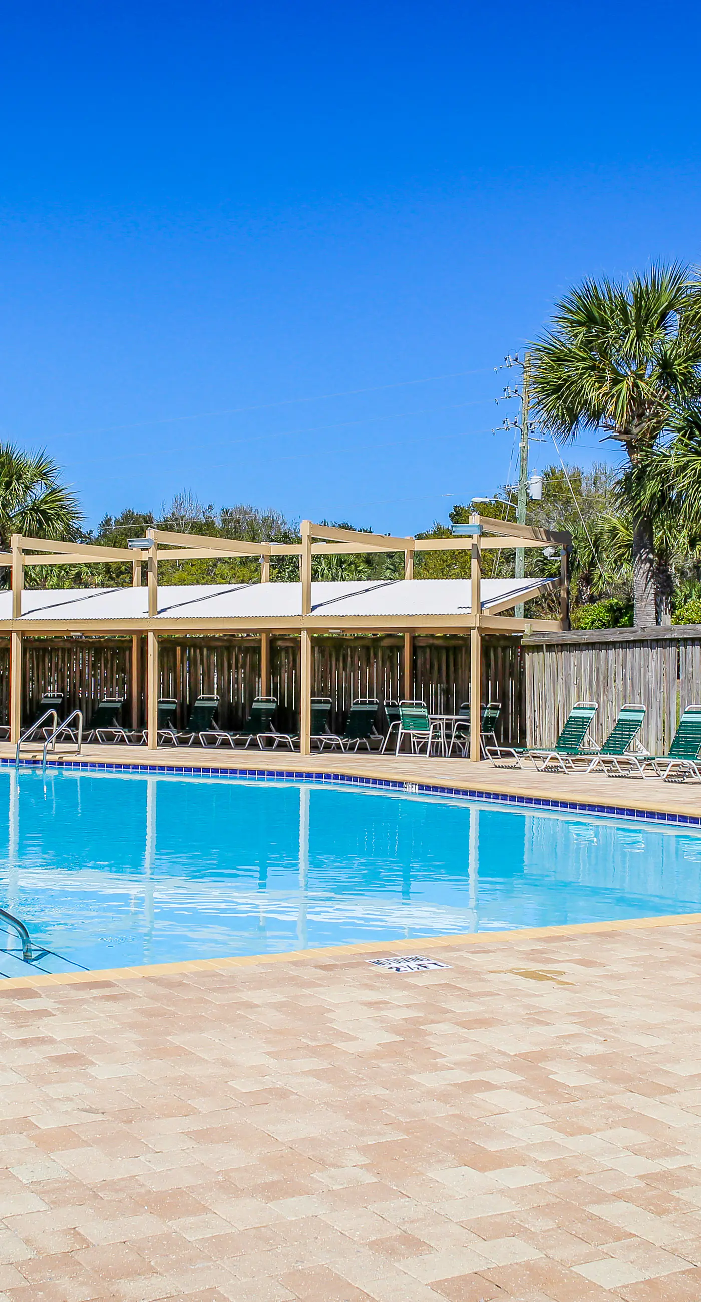 Lakefront condo near the beach with shared pool & two balconies - snowbird friendly
