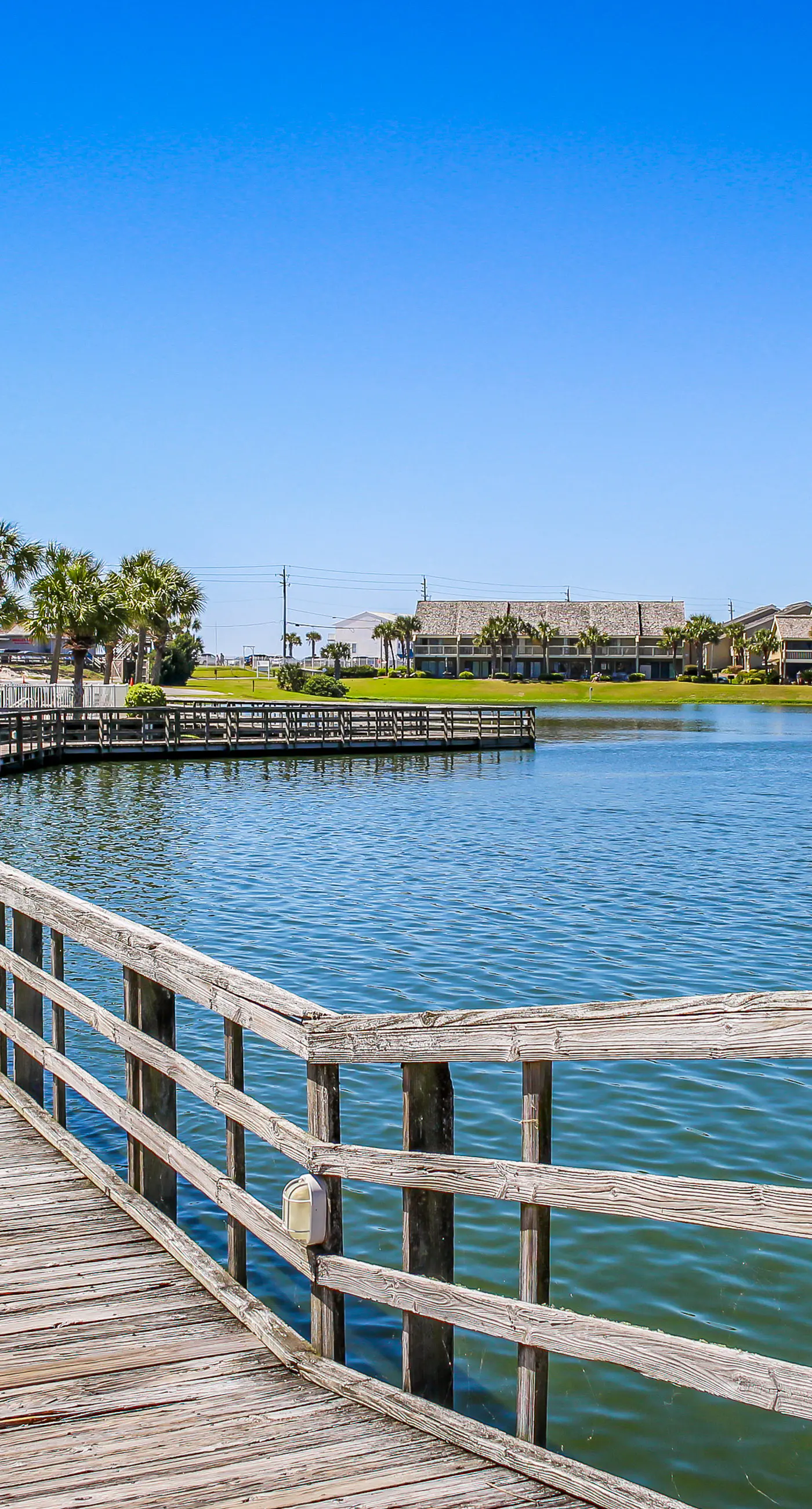 Lakefront condo near the beach with shared pool & two balconies - snowbird friendly