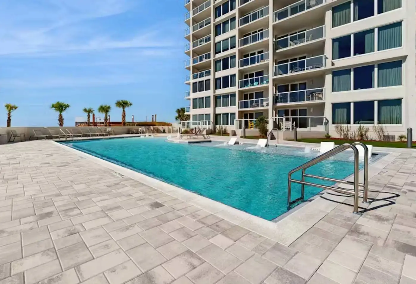 Beautiful beachfront condo with pool, beach tram, tennis, golf, & on-site dining