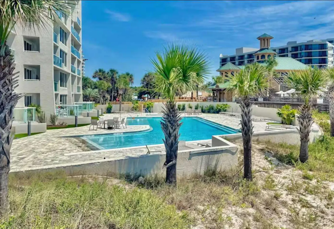 Beautiful beachfront condo with pool, beach tram, tennis, golf, & on-site dining