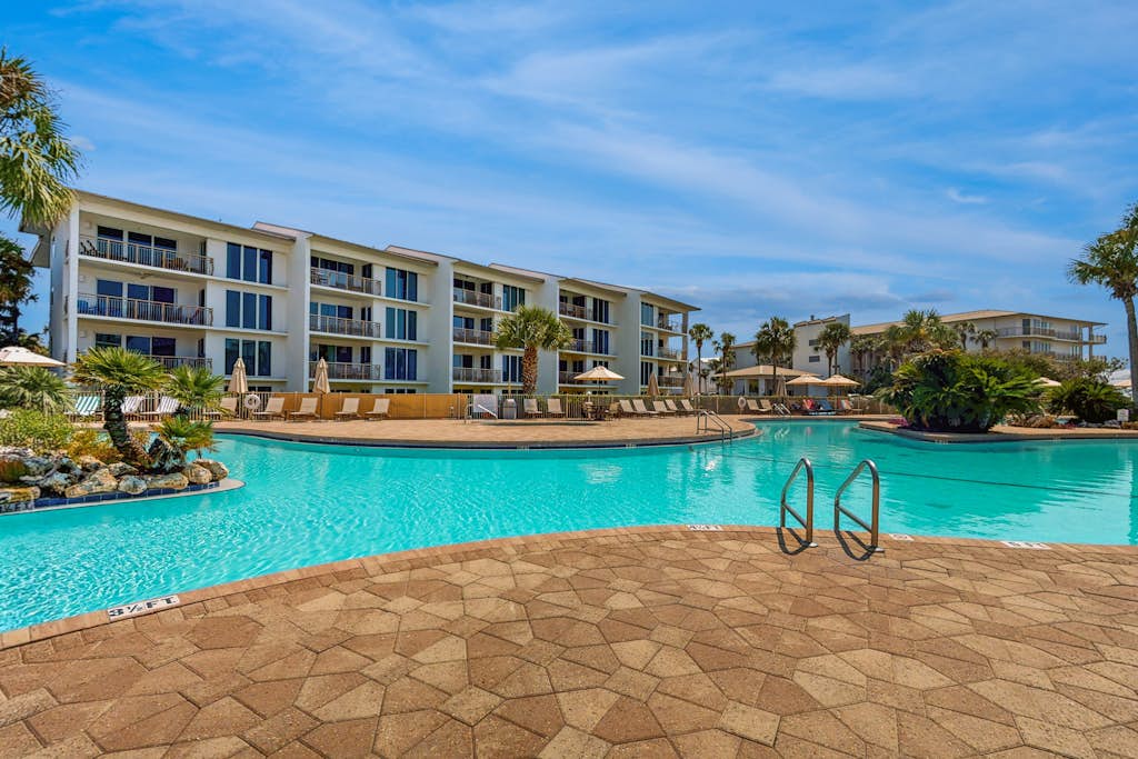 Open-concept beachfront home with balcony, lagoon pool, beach access, pickleball