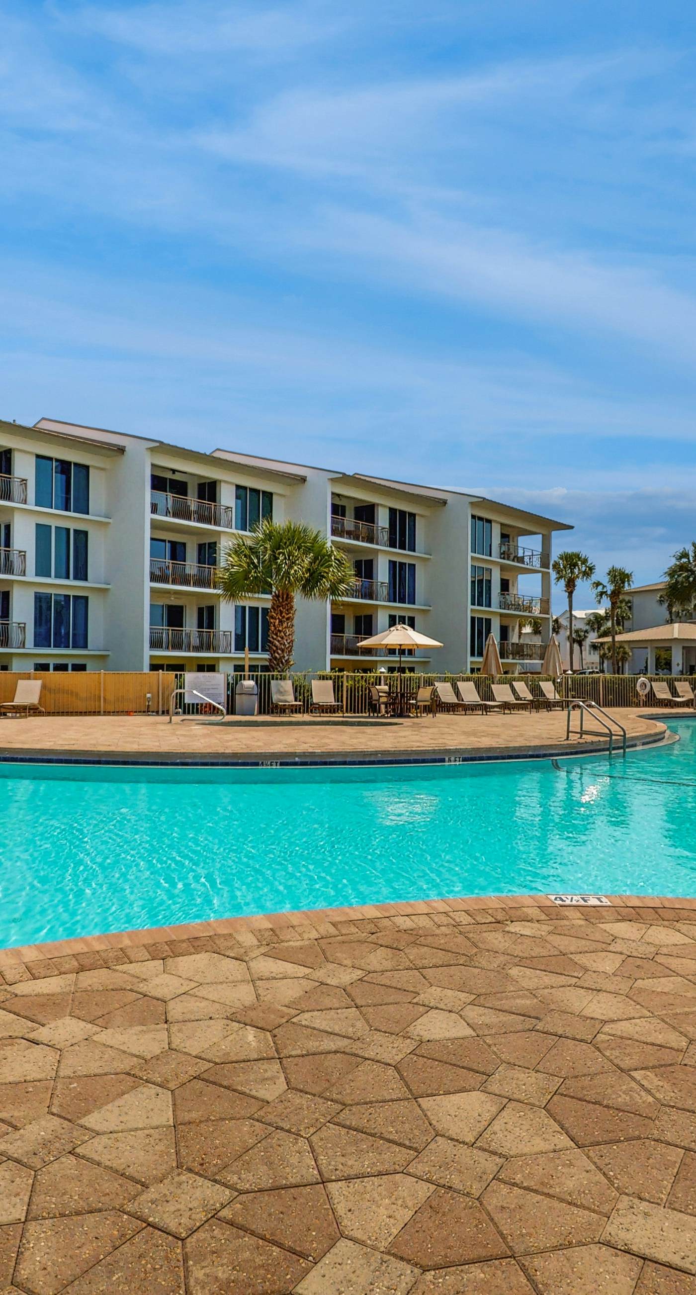 Open-concept beachfront home with balcony, lagoon pool, beach access, pickleball