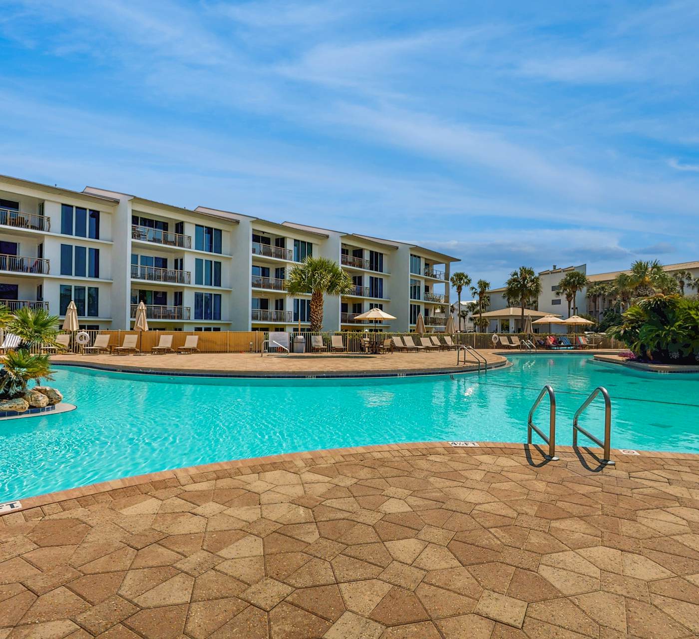 Open-concept beachfront home with balcony, lagoon pool ...