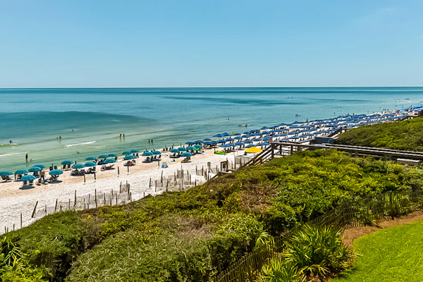 Open-concept beachfront home with balcony, lagoon pool, beach access, pickleball