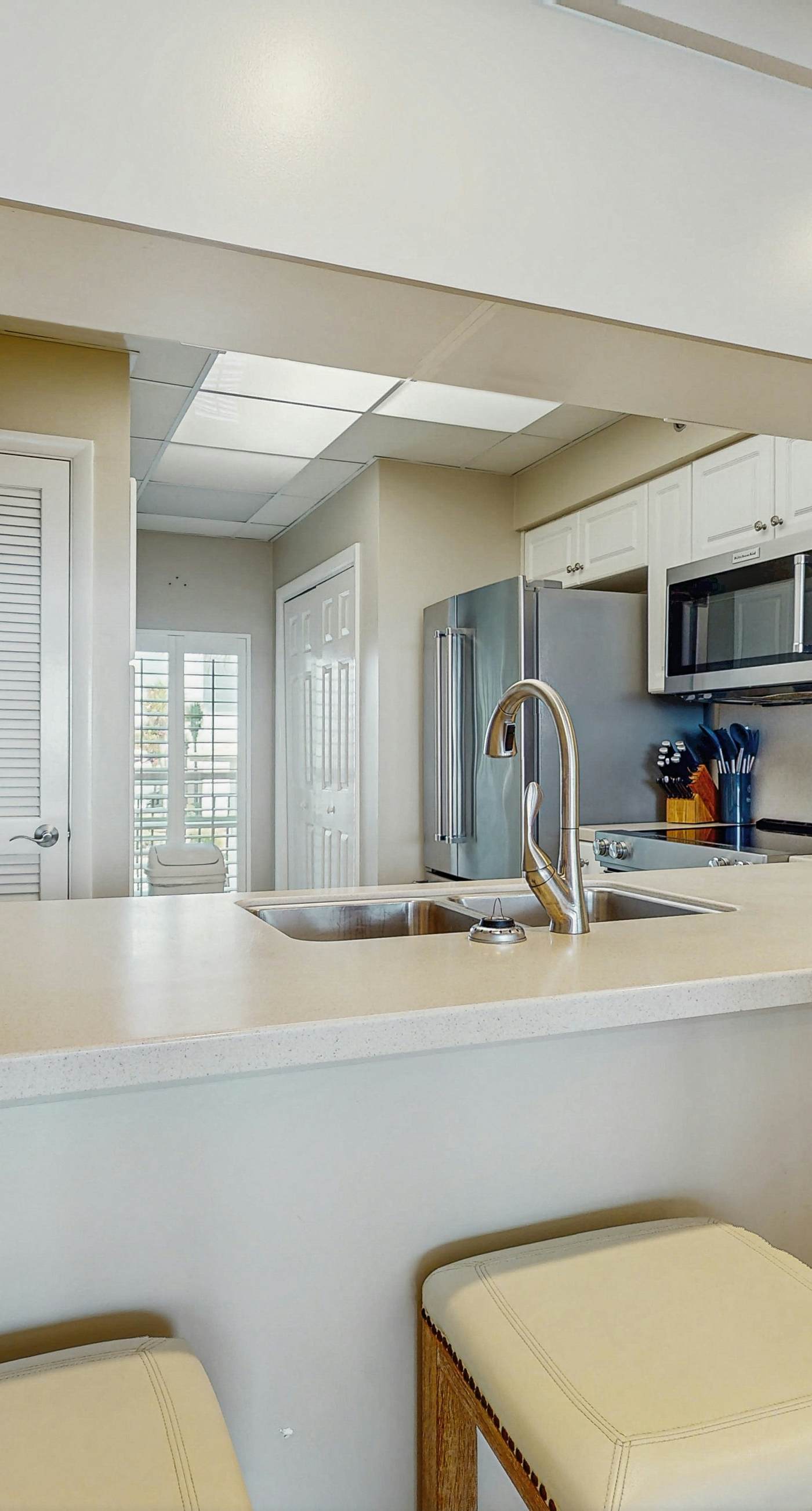 Open-concept beachfront home with balcony, lagoon pool, beach access, pickleball