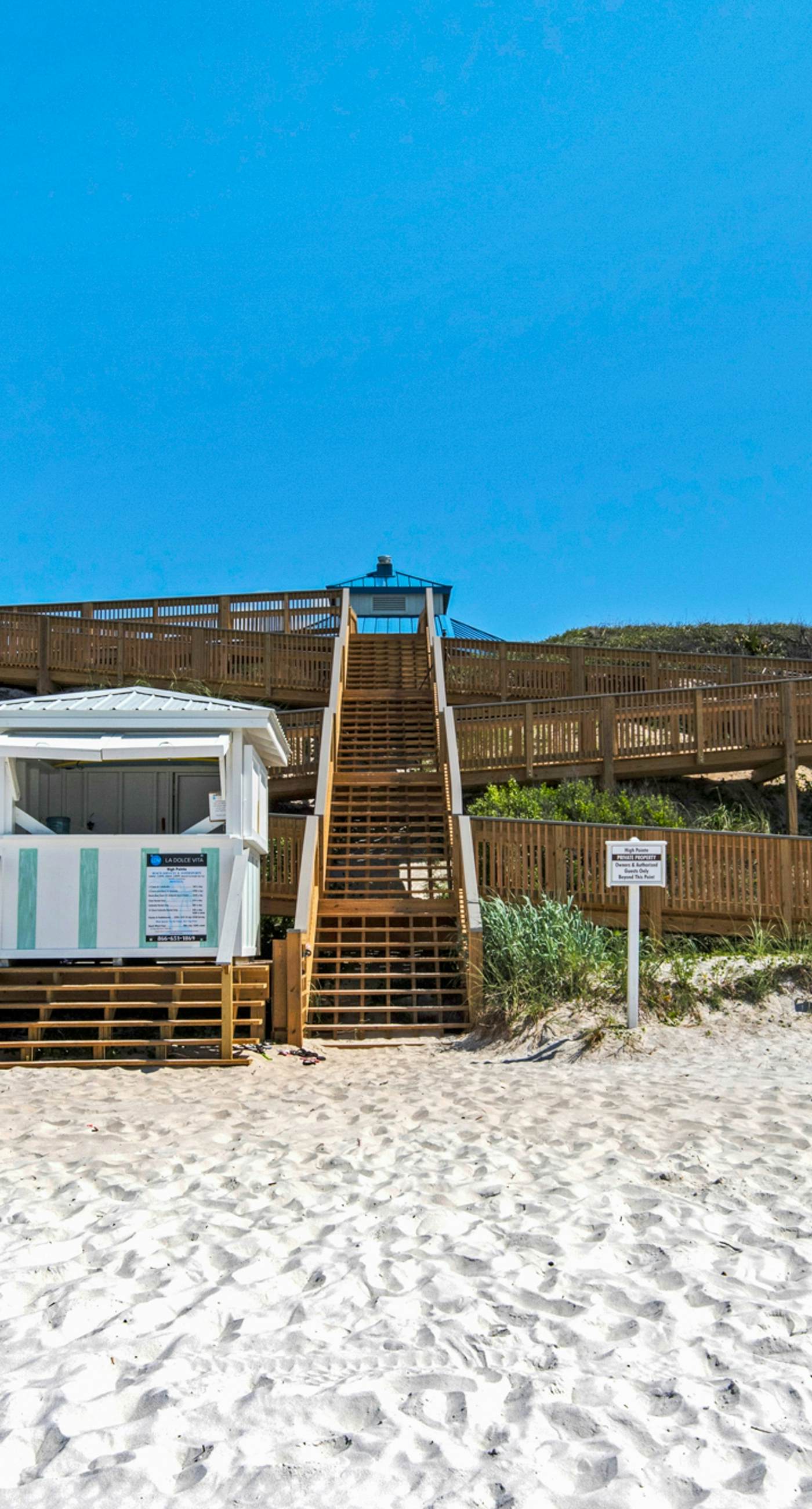 Open-concept beachfront home with balcony, lagoon pool, beach access, pickleball