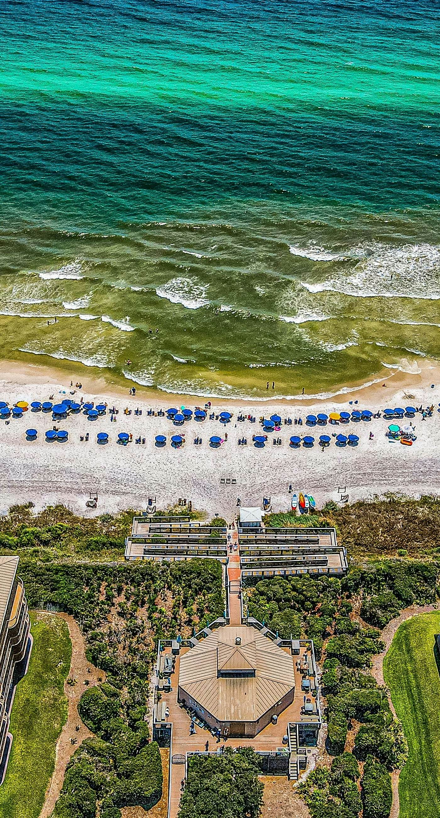 Open-concept beachfront home with balcony, lagoon pool, beach access, pickleball