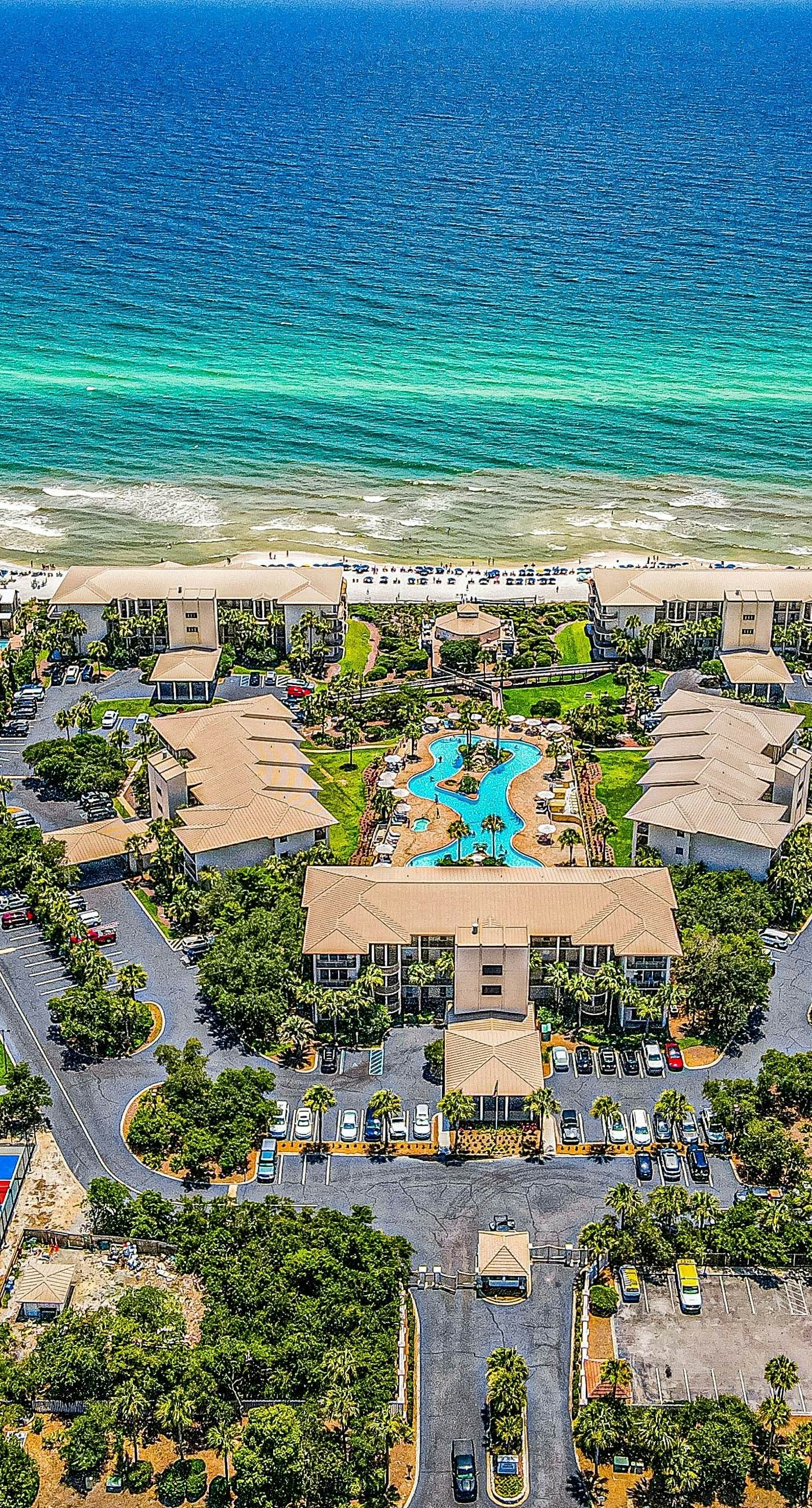 Open-concept beachfront home with balcony, lagoon pool, beach access, pickleball