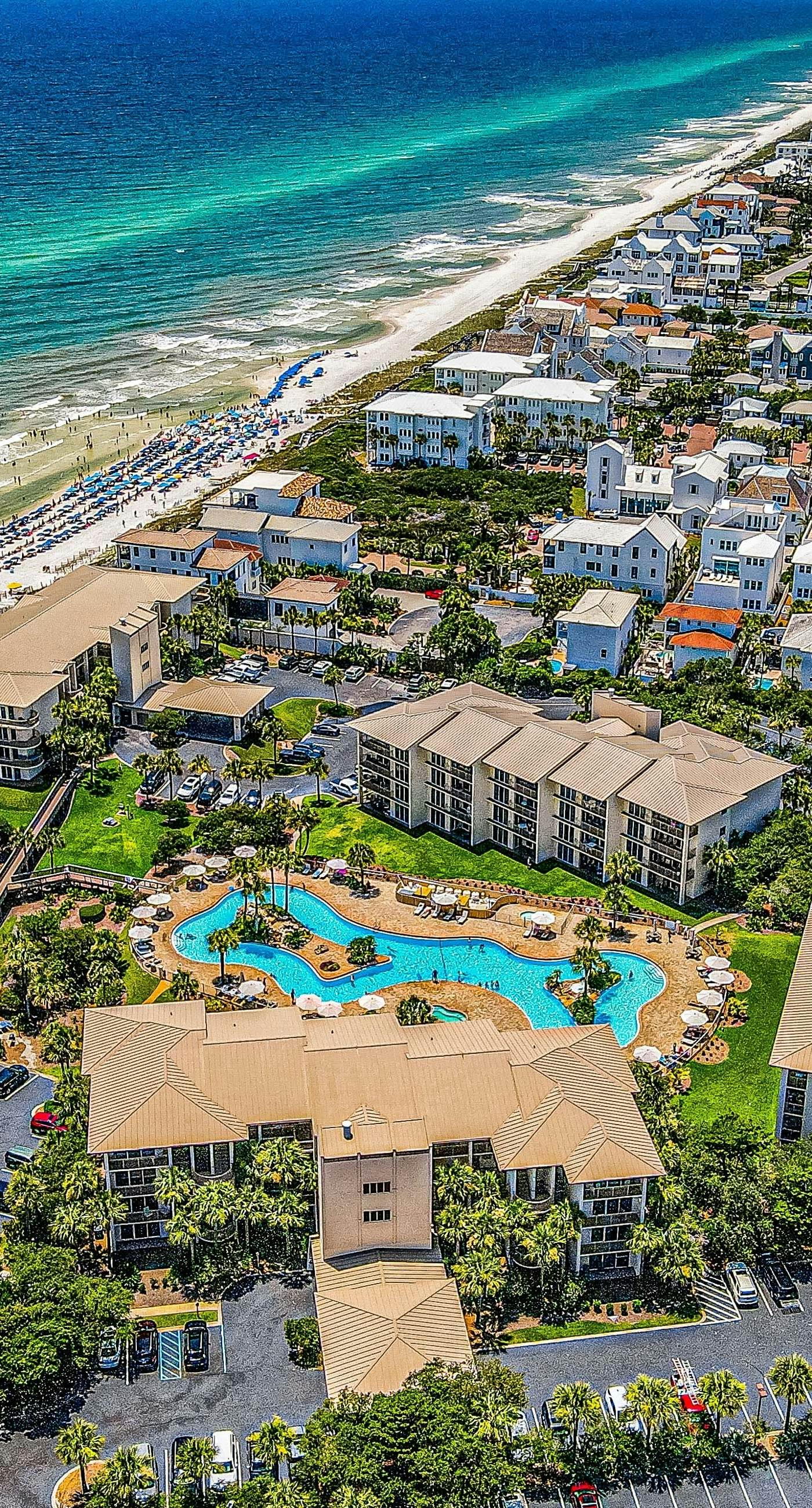 Open-concept beachfront home with balcony, lagoon pool, beach access, pickleball