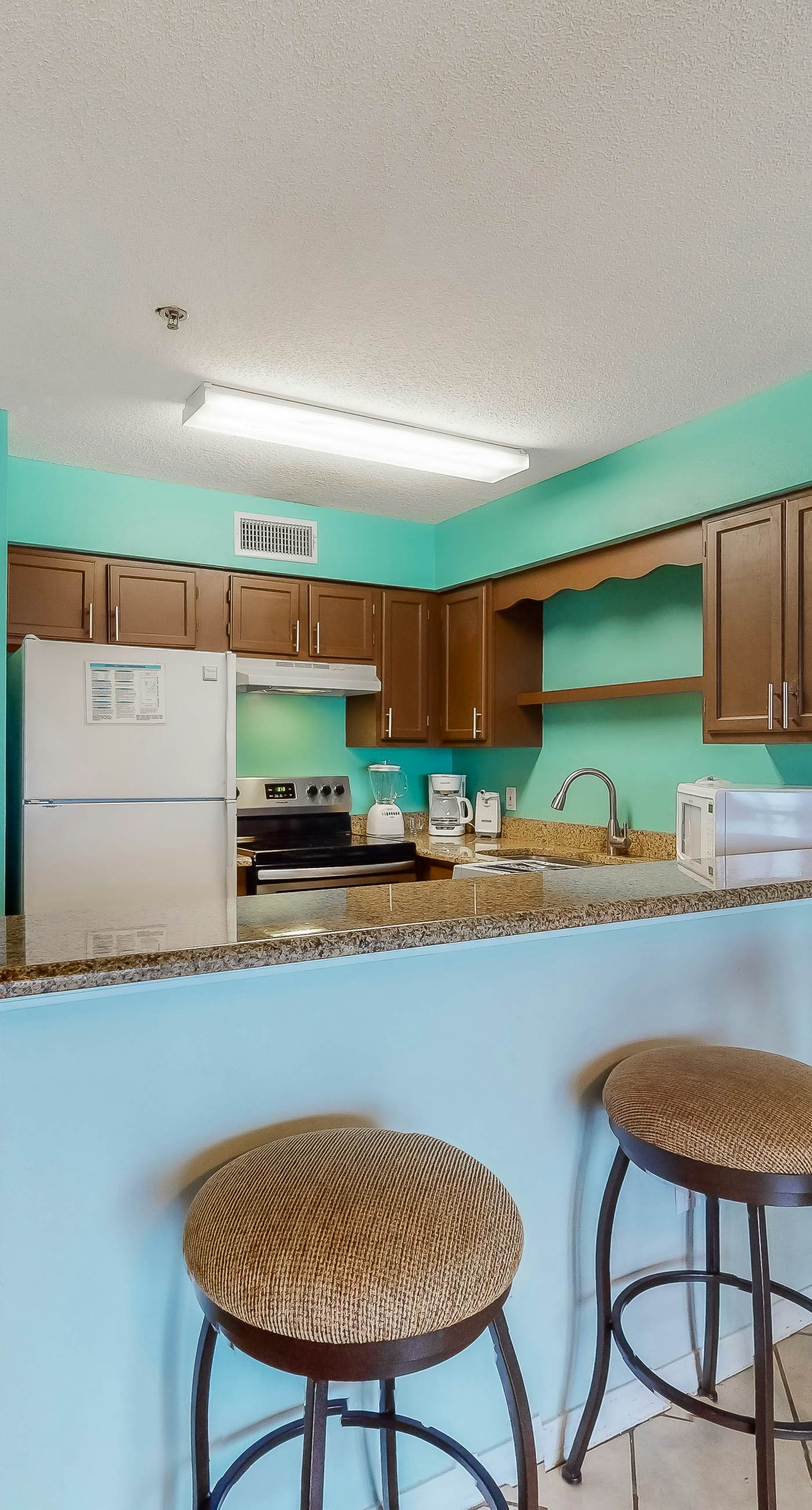 Oceanfront Condo with AC, WiFi, Shared Pool, & Seasonal Beach Service Rentals