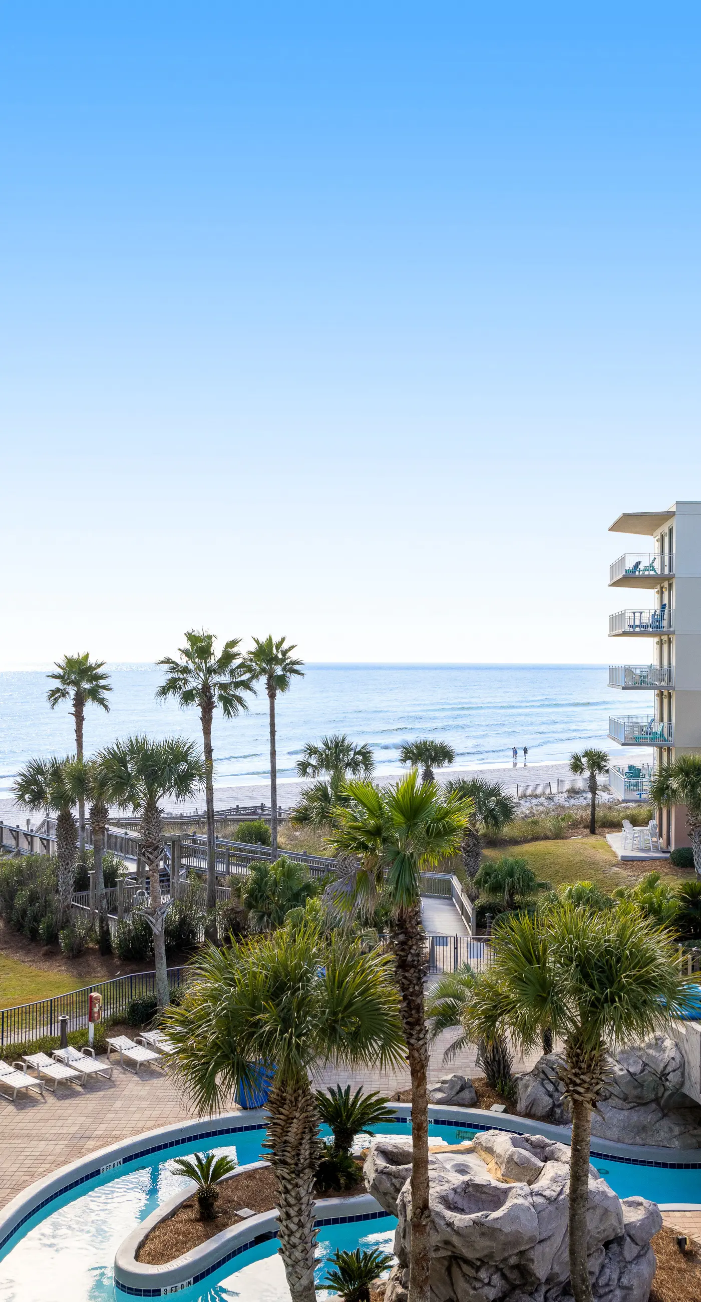 Elegant oceanfront condo with Gulf views, central AC, and shared pool & hot tub