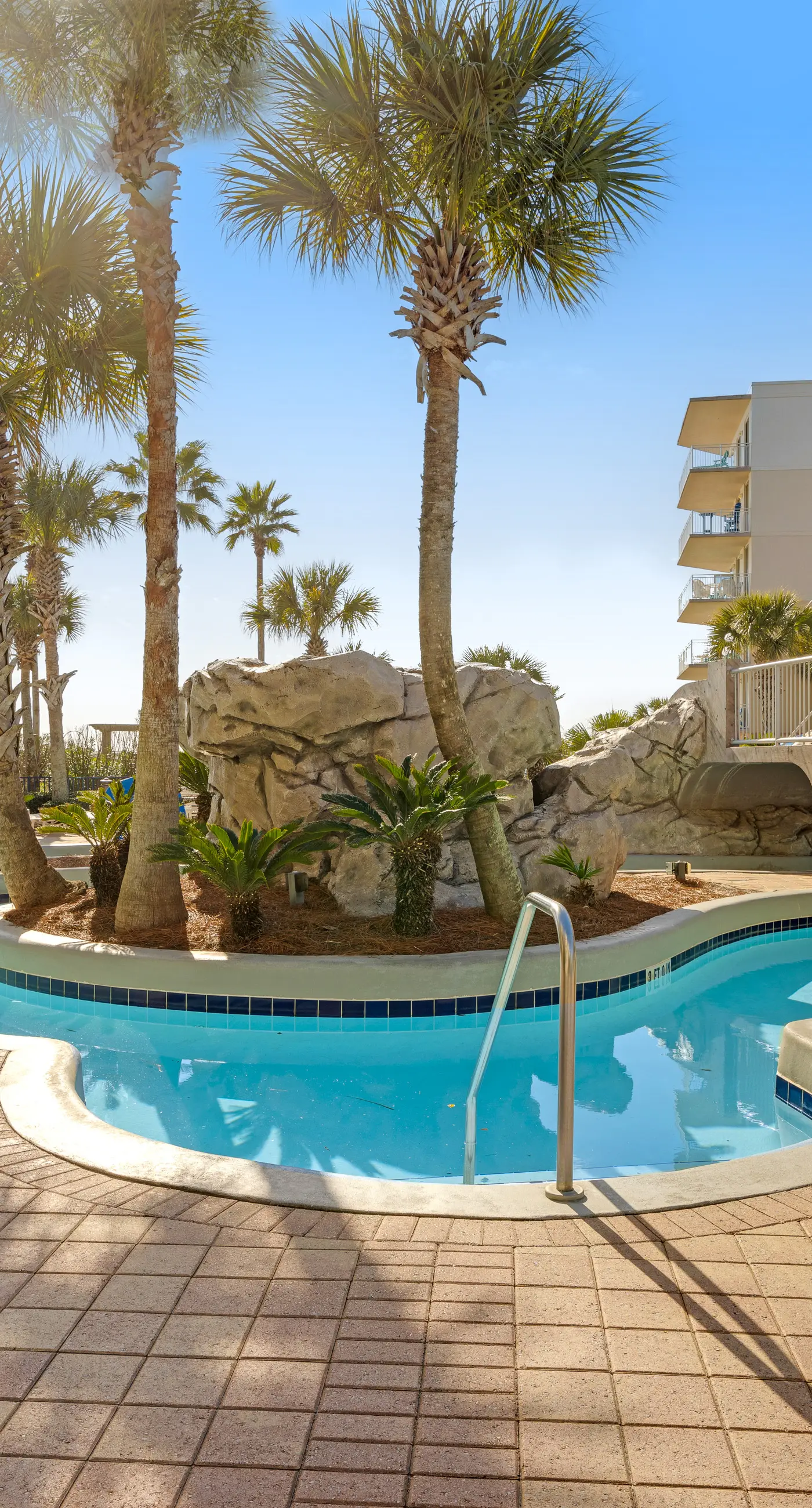 Elegant oceanfront condo with Gulf views, central AC, and shared pool & hot tub