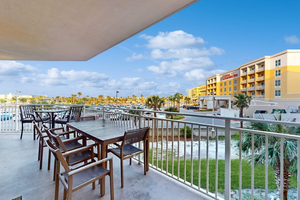 2nd-floor condo with balcony at Waterscape Waterfall, lazy river & beach chairs