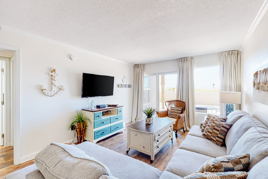 First-floor condo with pool, ocean view, & central AC