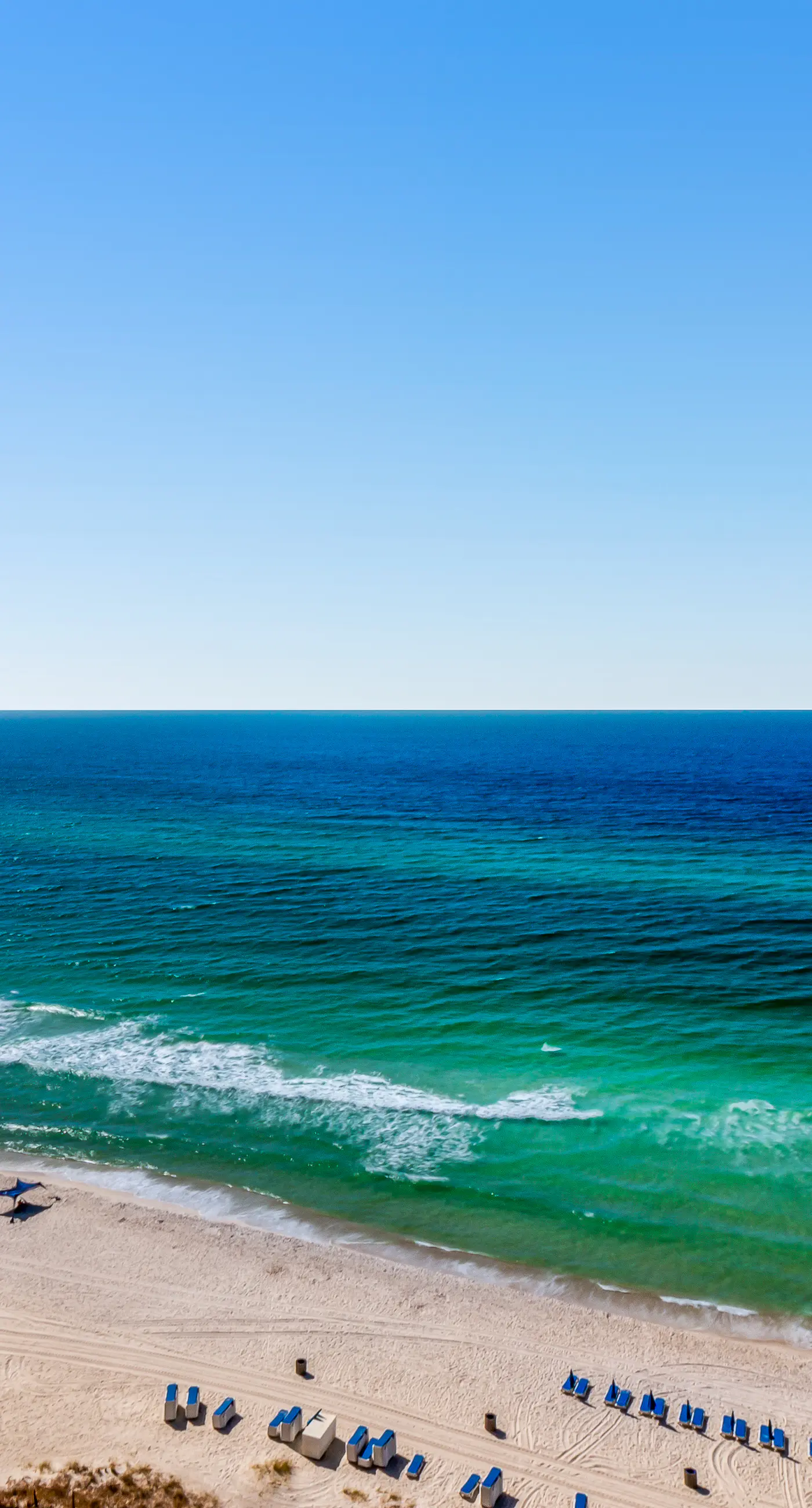 Stunning Gulf-front condo with balcony, pool, hot tub, gym & beach views