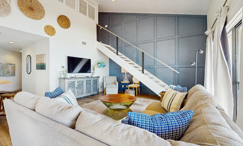 Ideally located beachfront home with balcony, washer/dryer, AC, & amazing views