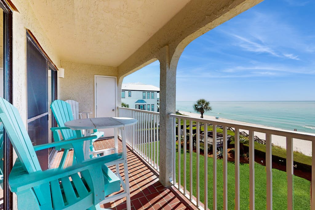 Ideally located beachfront home with balcony, washer/dryer, AC, & amazing views