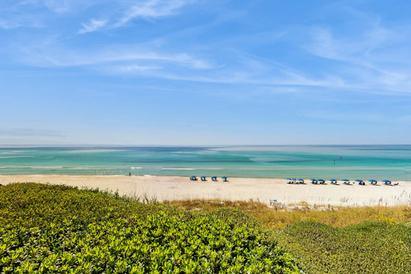 Ideally located beachfront home with balcony, washer/dryer, AC, & amazing views