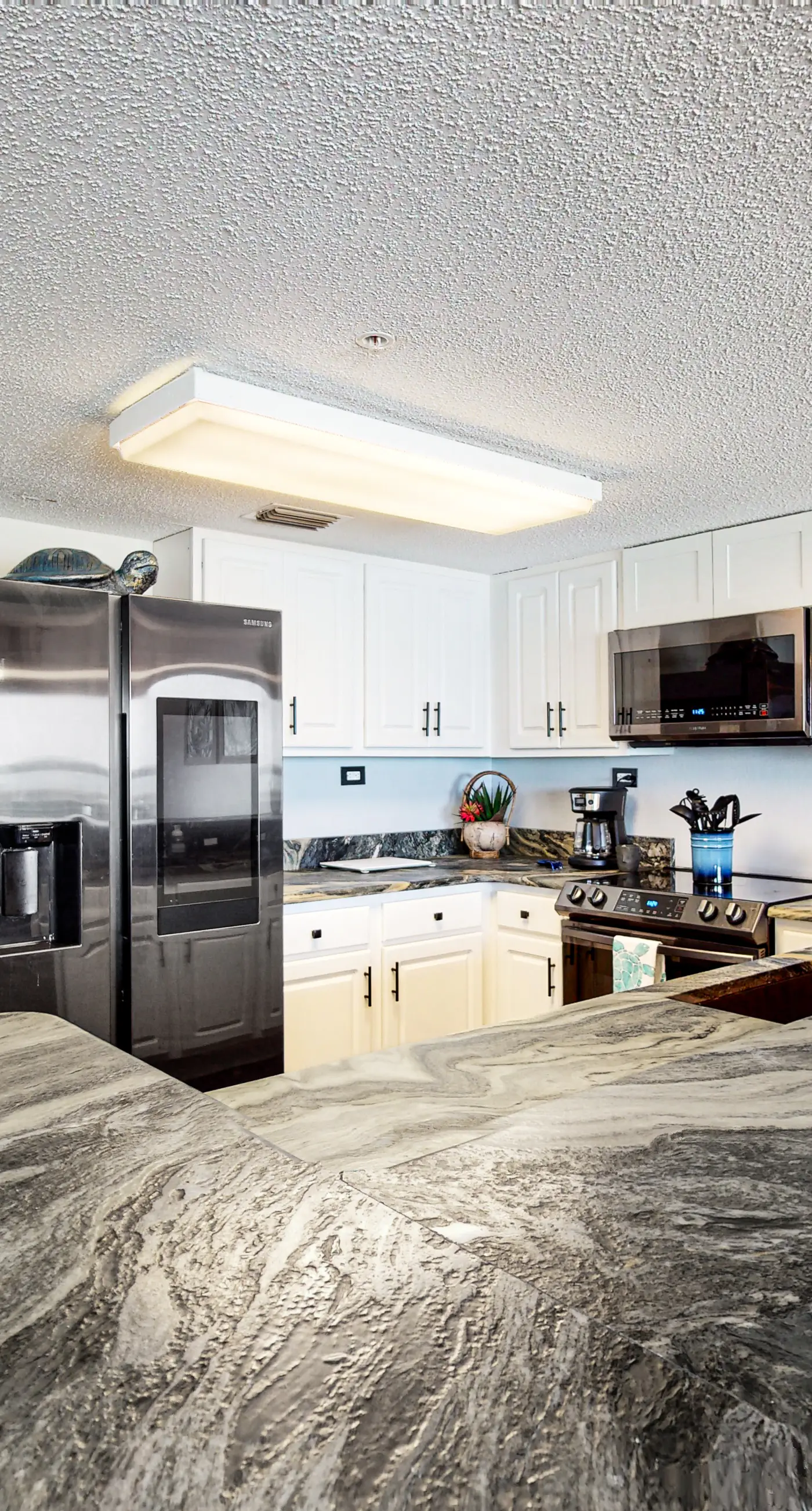 Beachfront condo with gulf views, pool, gym, & private balcony