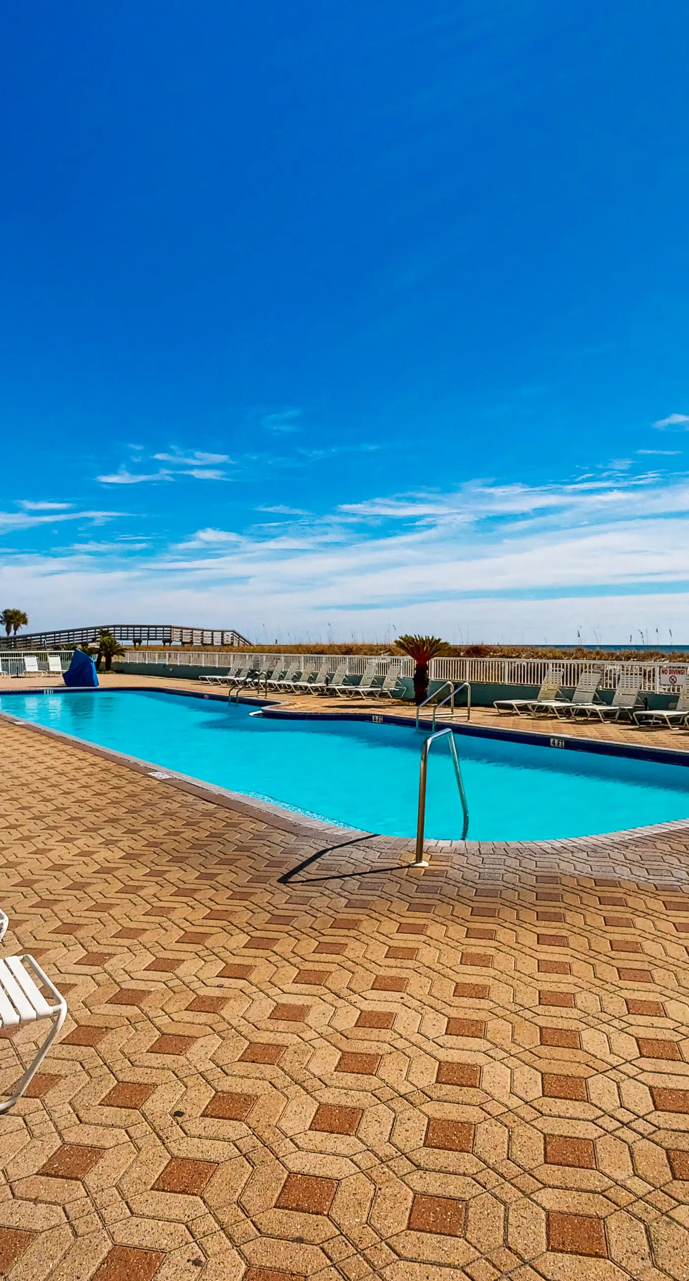 Beachfront condo with gulf views, pool, gym, & private balcony