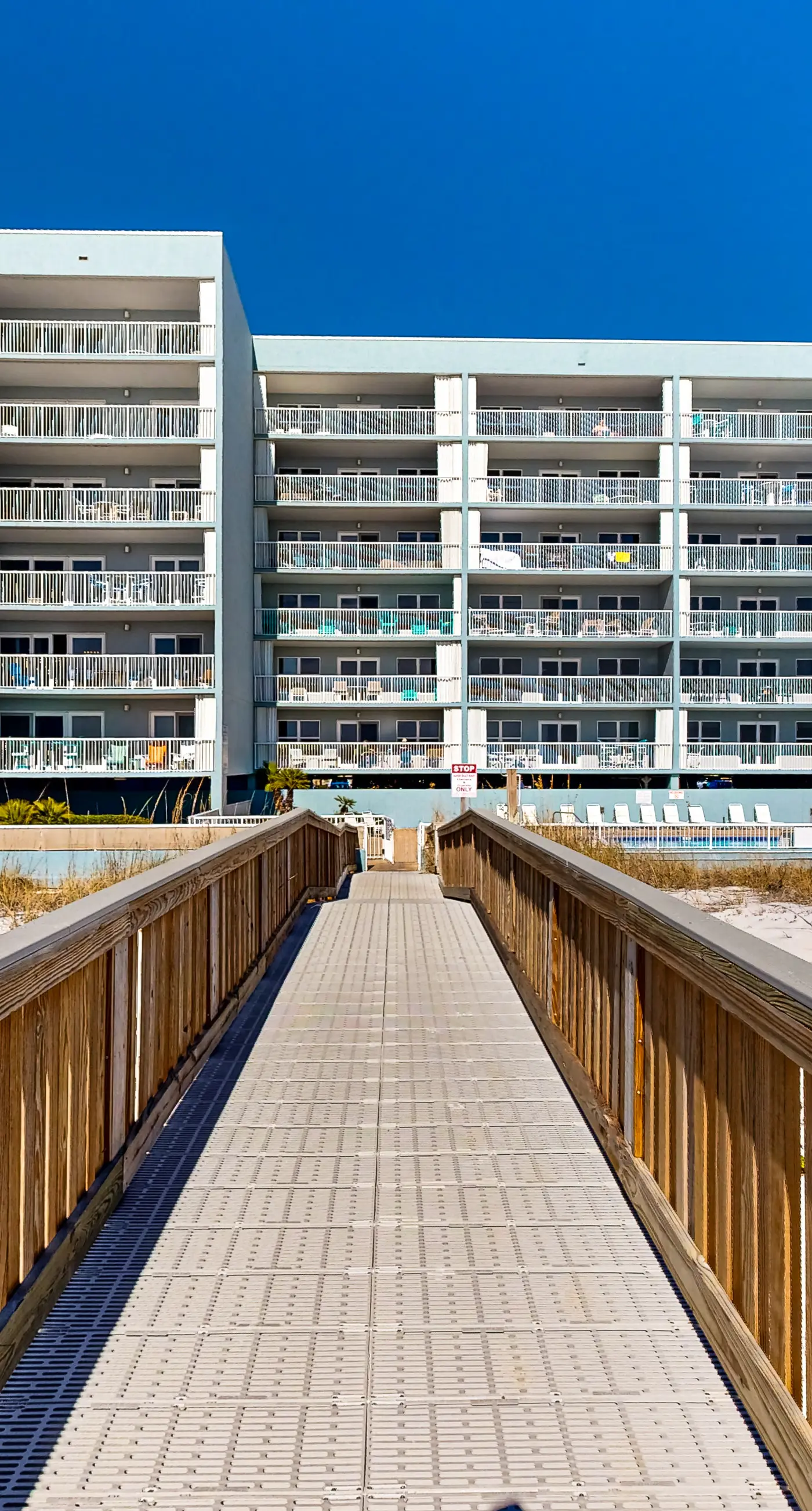 Beachfront condo with gulf views, pool, gym, & private balcony