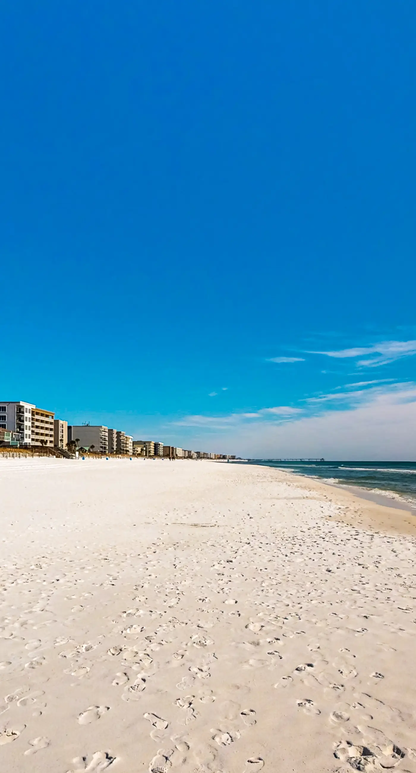 Beachfront condo with gulf views, pool, gym, & private balcony