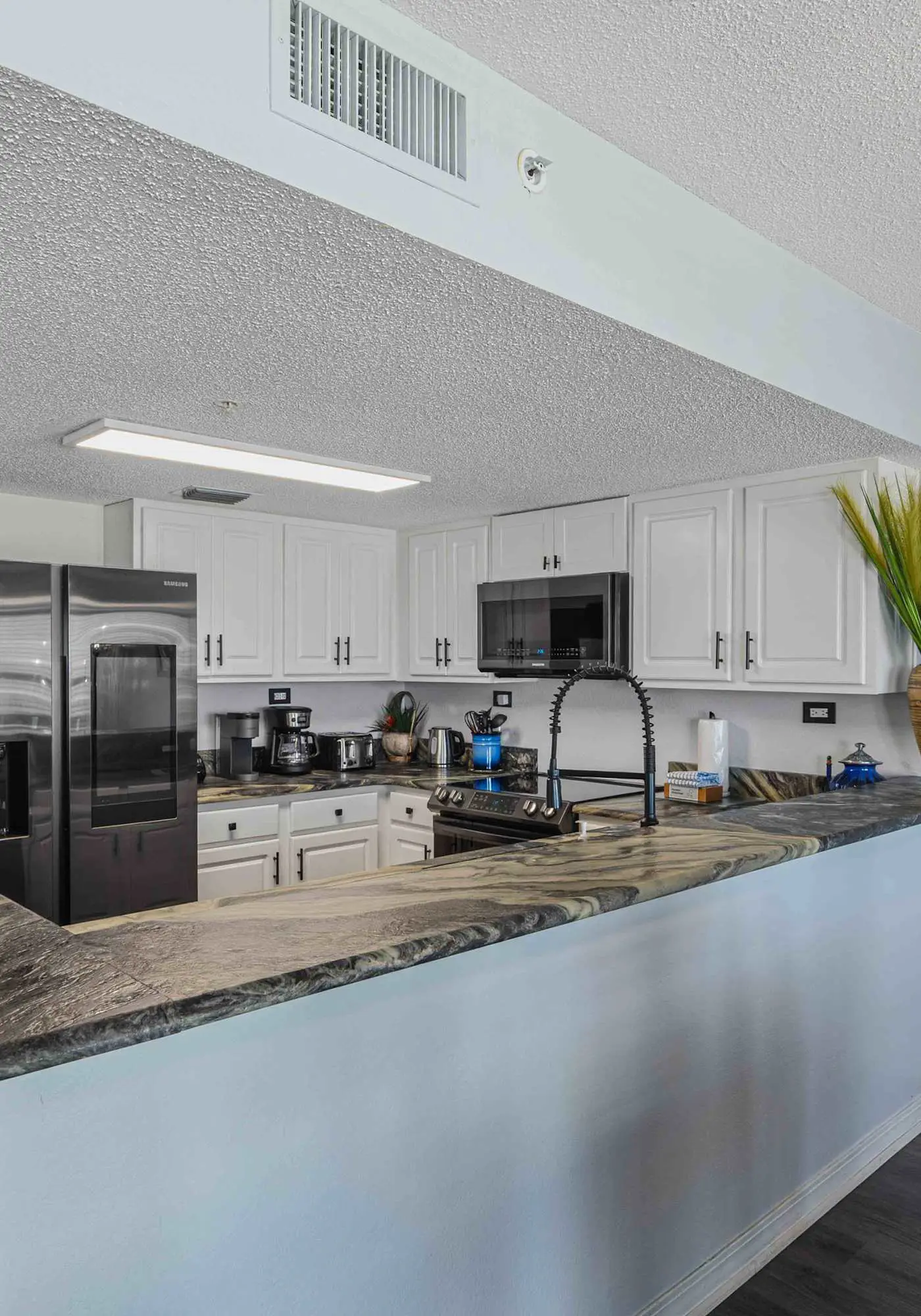Beachfront condo with gulf views, pool, gym, & private balcony