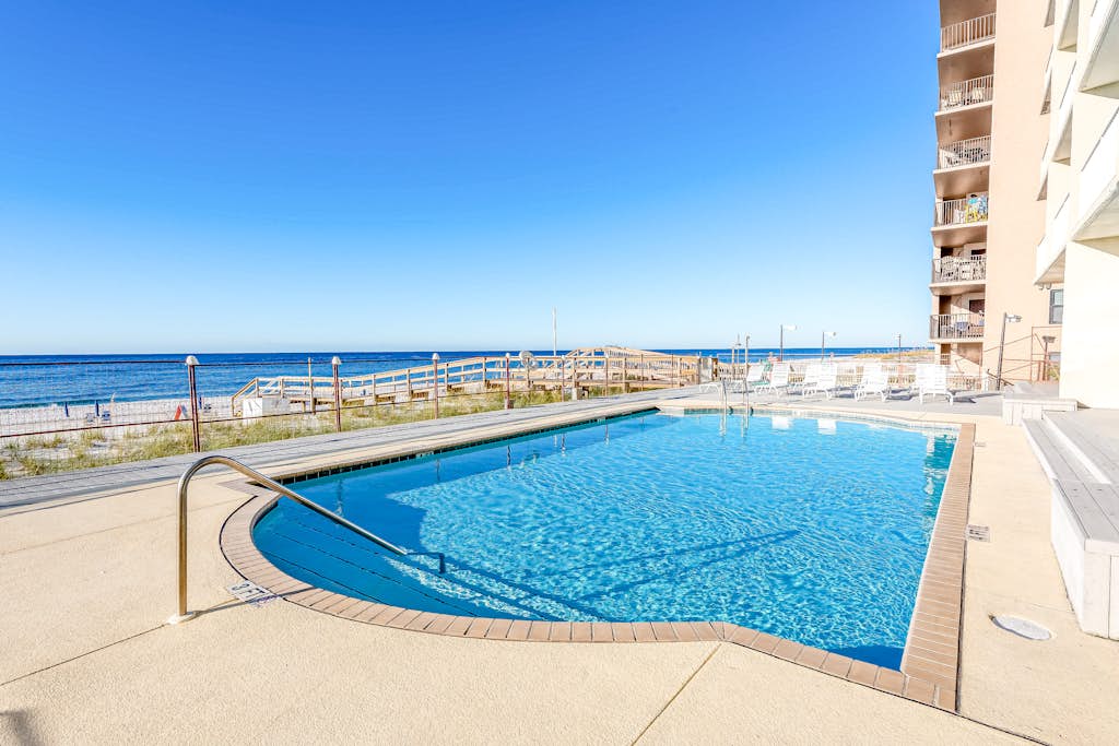 Gulf-front condo with shared pool & gym, balcony, WiFi, & great view