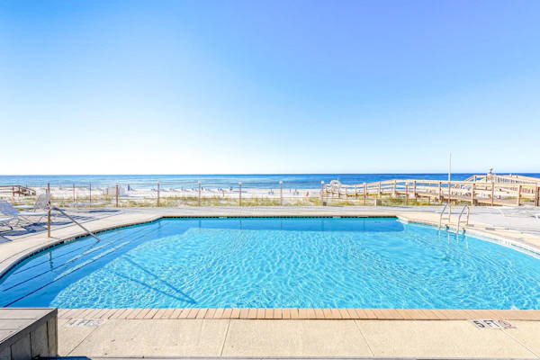 Gulf-front condo with shared pool & gym, balcony, WiFi, & great view