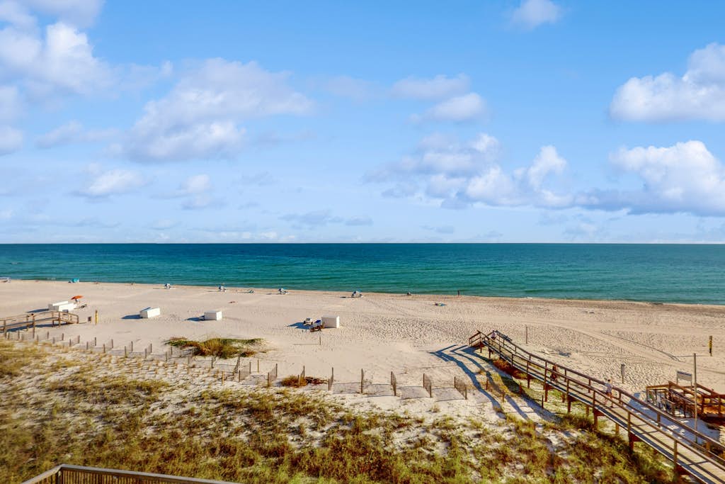 Gulf-front condo with shared pool & gym, balcony, WiFi, & great view