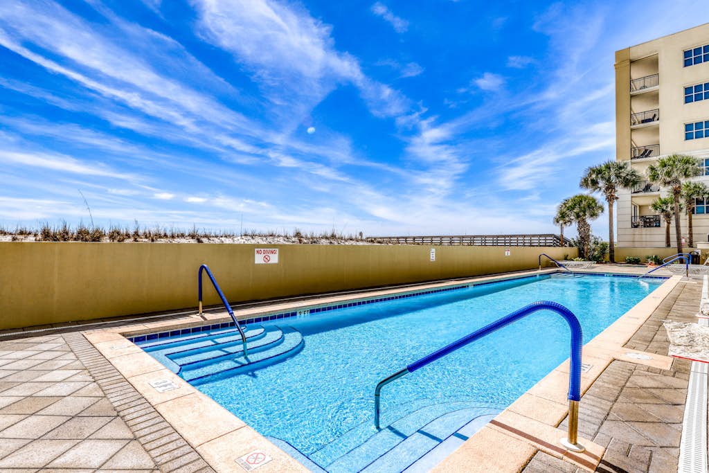 Stylish beach getaway with shared pool, private balcony, gulf views & fast WiFi